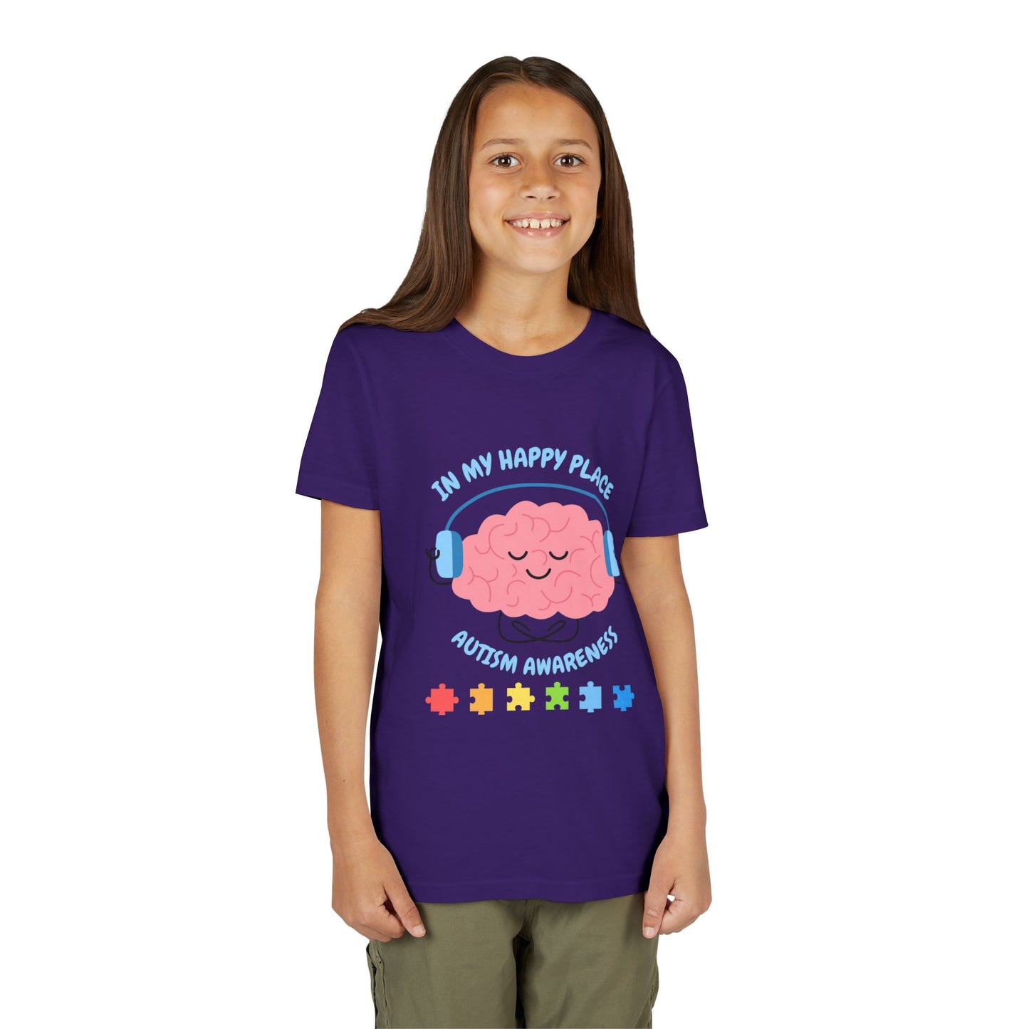 Girl wearing a youth tee for Autism Awareness with smiling brain with headphones and colorful puzzle pieces, "In My Happy Place" graphic. Team Purple