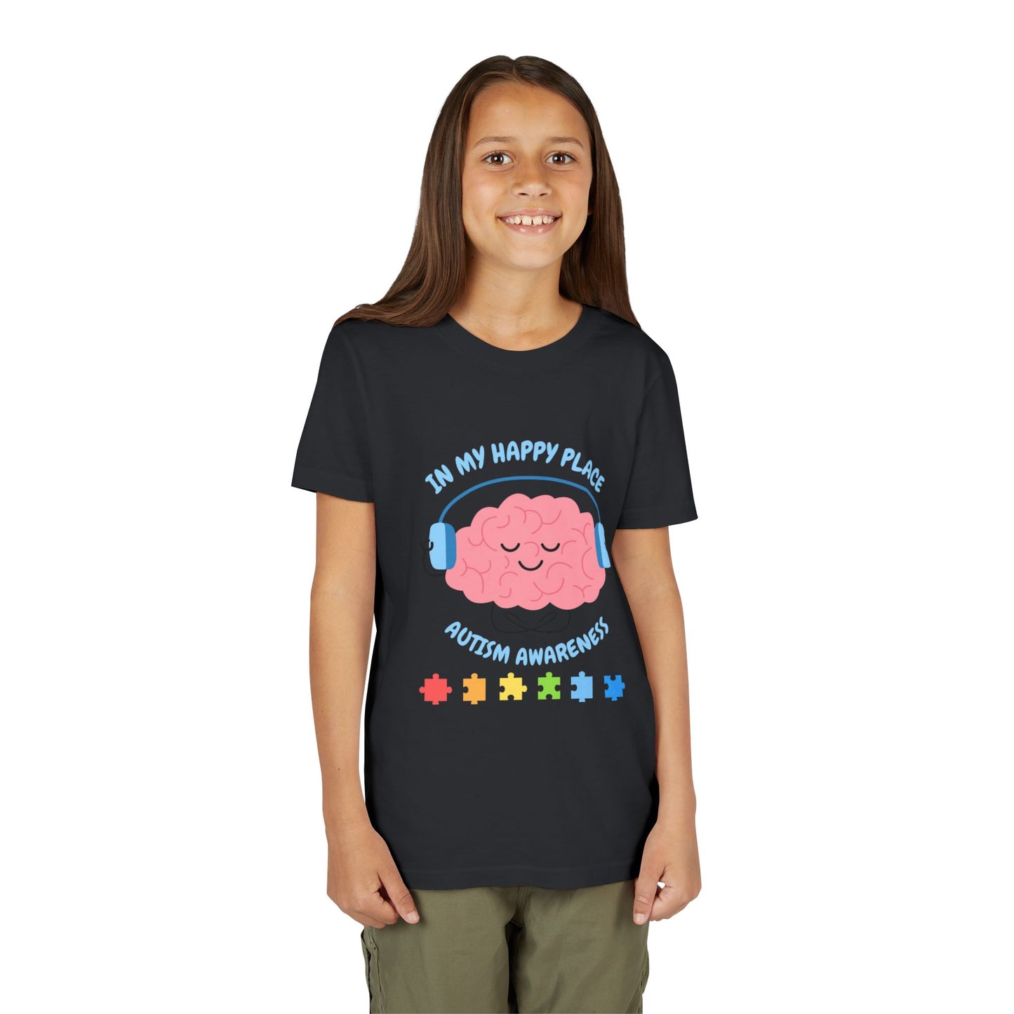 Girl wearing a youth tee for Autism Awareness with smiling brain with headphones and colorful puzzle pieces, "In My Happy Place" graphic. Vintage Black