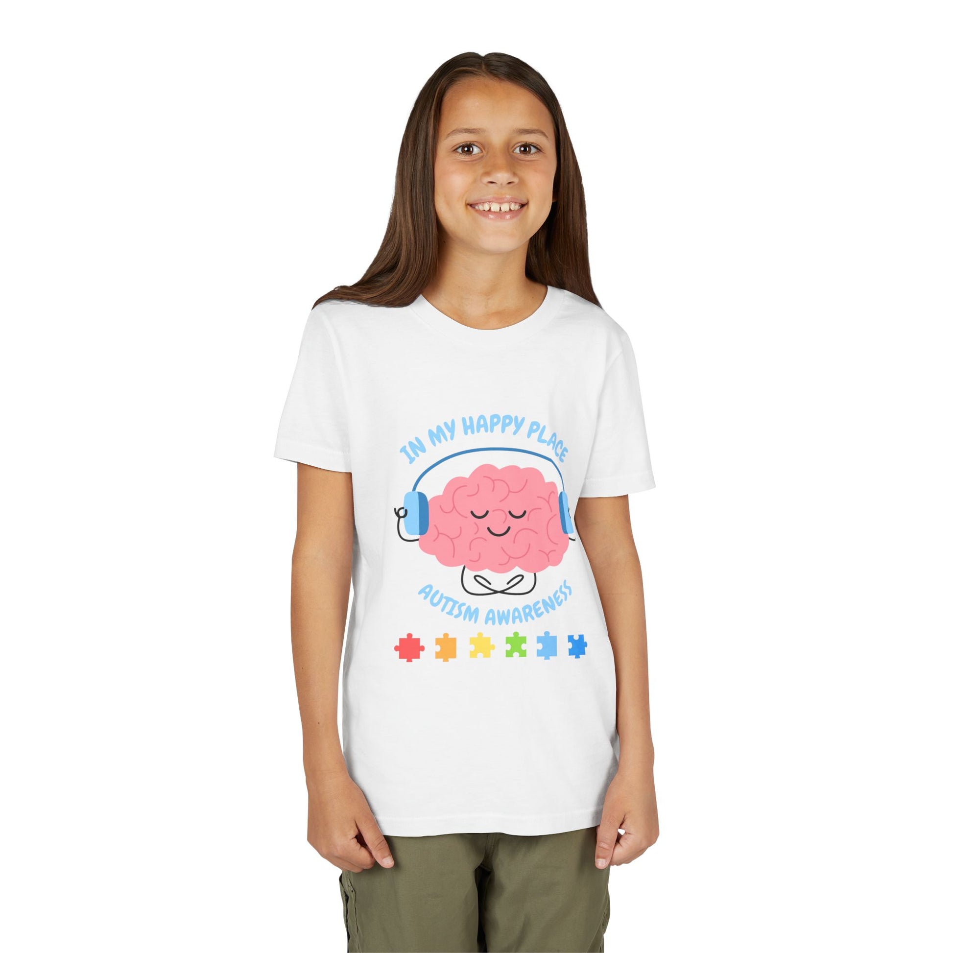 Girl wearing a youth tee for Autism Awareness with smiling brain with headphones and colorful puzzle pieces, "In My Happy Place" graphic. White
