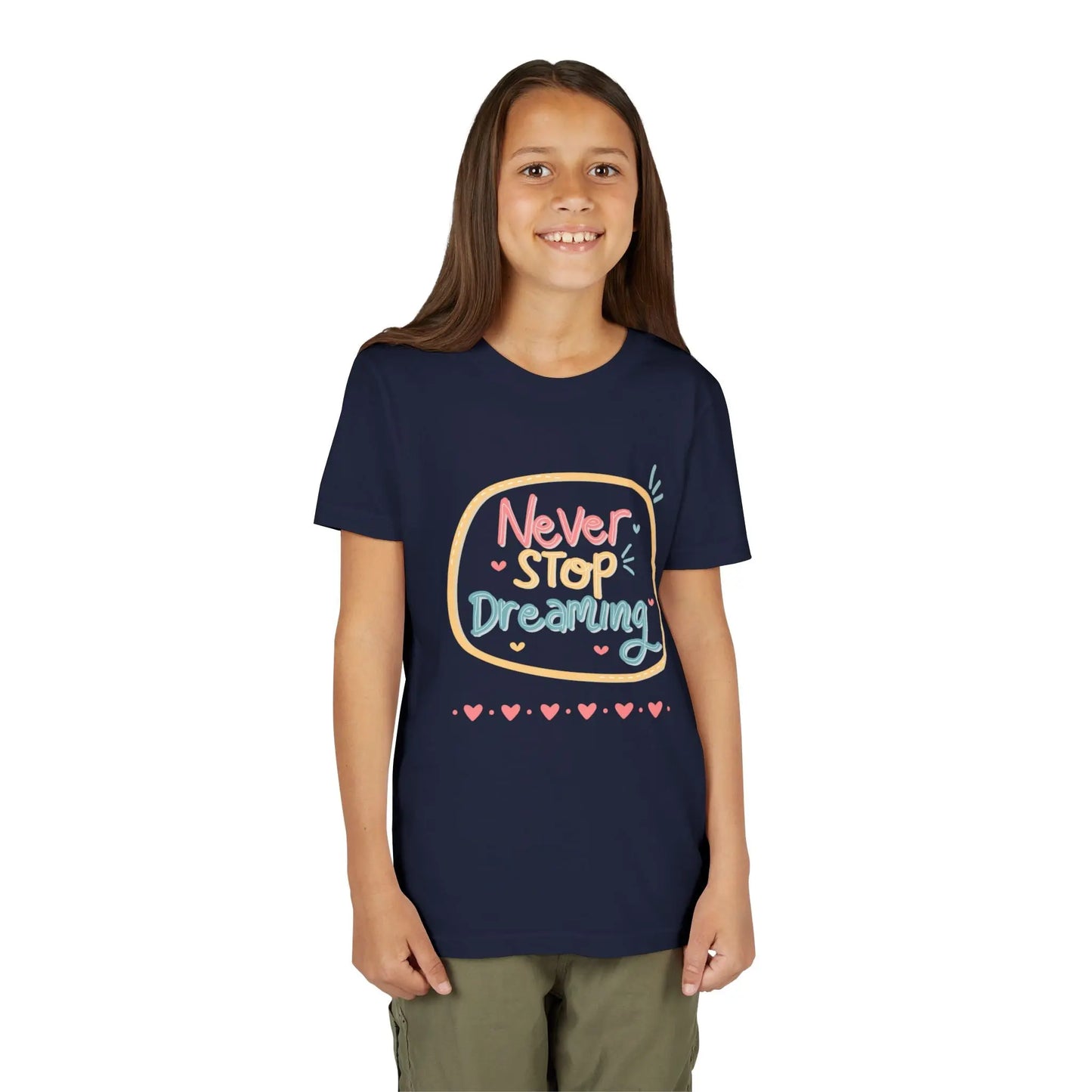 Youth wearing this encouraging youth tee with "Never Stop Dreaming" message. Soft cotton, perfect for school, everyday wear, and inspiring creativity. Motivational kids' clothing. Navy