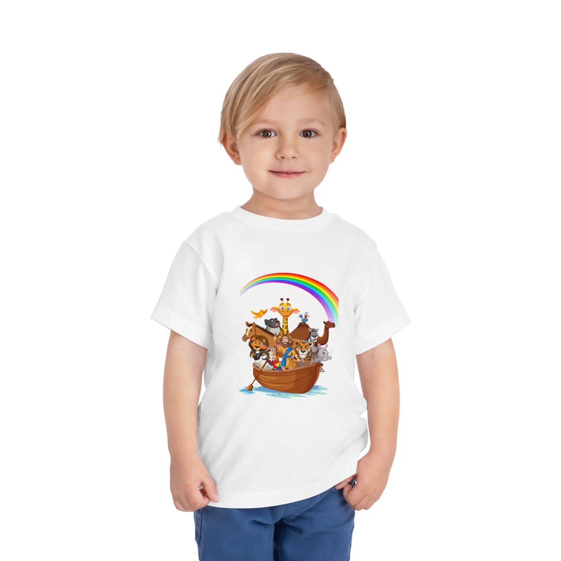 Child wearing a White toddler t-shirt with an Adorable Noah's Ark with animals, rainbow & ark print. Soft cotton, sizes 2T–5T. Perfect Christian kids gift or Bible story outfit. 