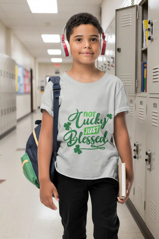 Youth wearing Not Lucky Just Blessed tee with shamrocks and faith-based message, Athletic Grey
