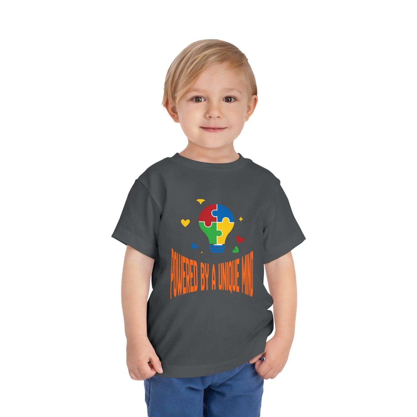  Celebrate neurodiversity with this "Powered by a Unique Mind" autism toddler tee. Featuring a puzzle lightbulb design, it's a sweet autism awareness shirt for little ones. Asphalt