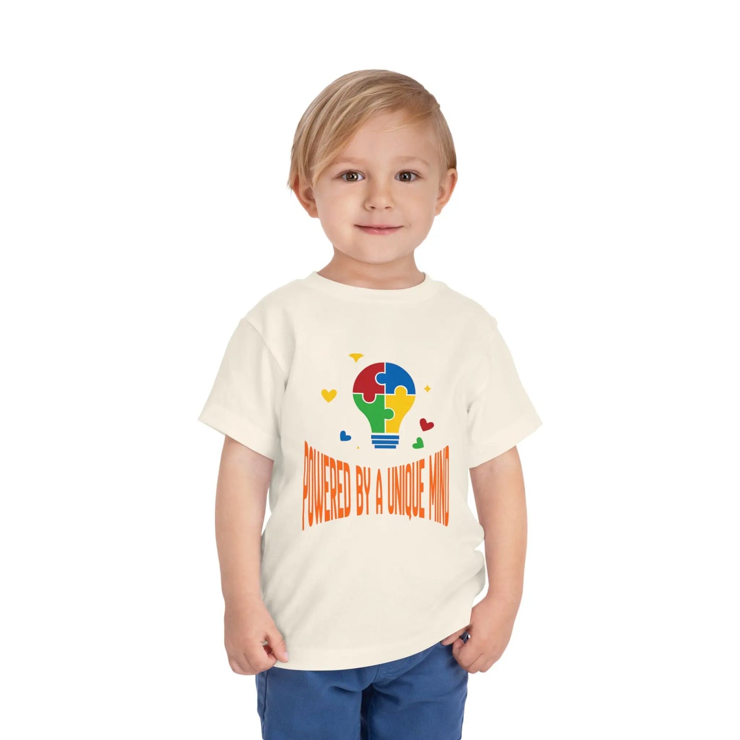  Celebrate neurodiversity with this "Powered by a Unique Mind" autism toddler tee. Featuring a puzzle lightbulb design, it's a sweet autism awareness shirt for little ones. Natural