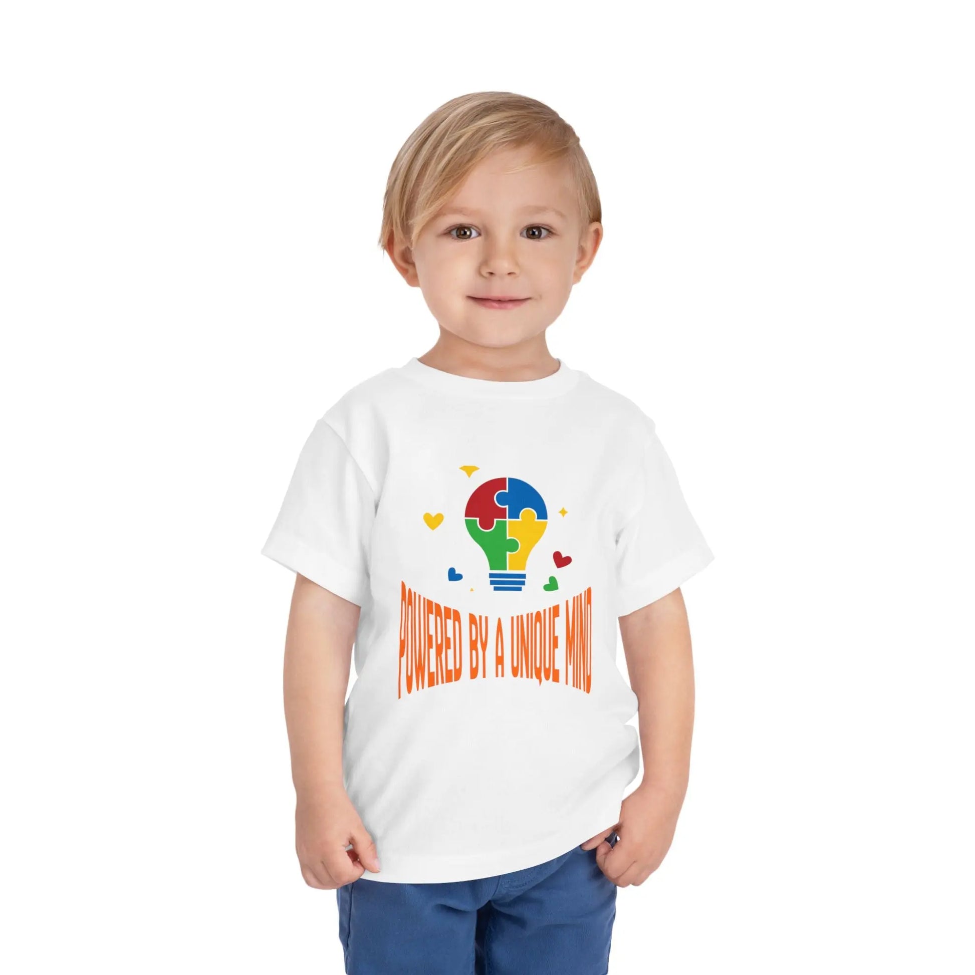  Celebrate neurodiversity with this "Powered by a Unique Mind" autism toddler tee. Featuring a puzzle lightbulb design, it's a sweet autism awareness shirt for little ones. White