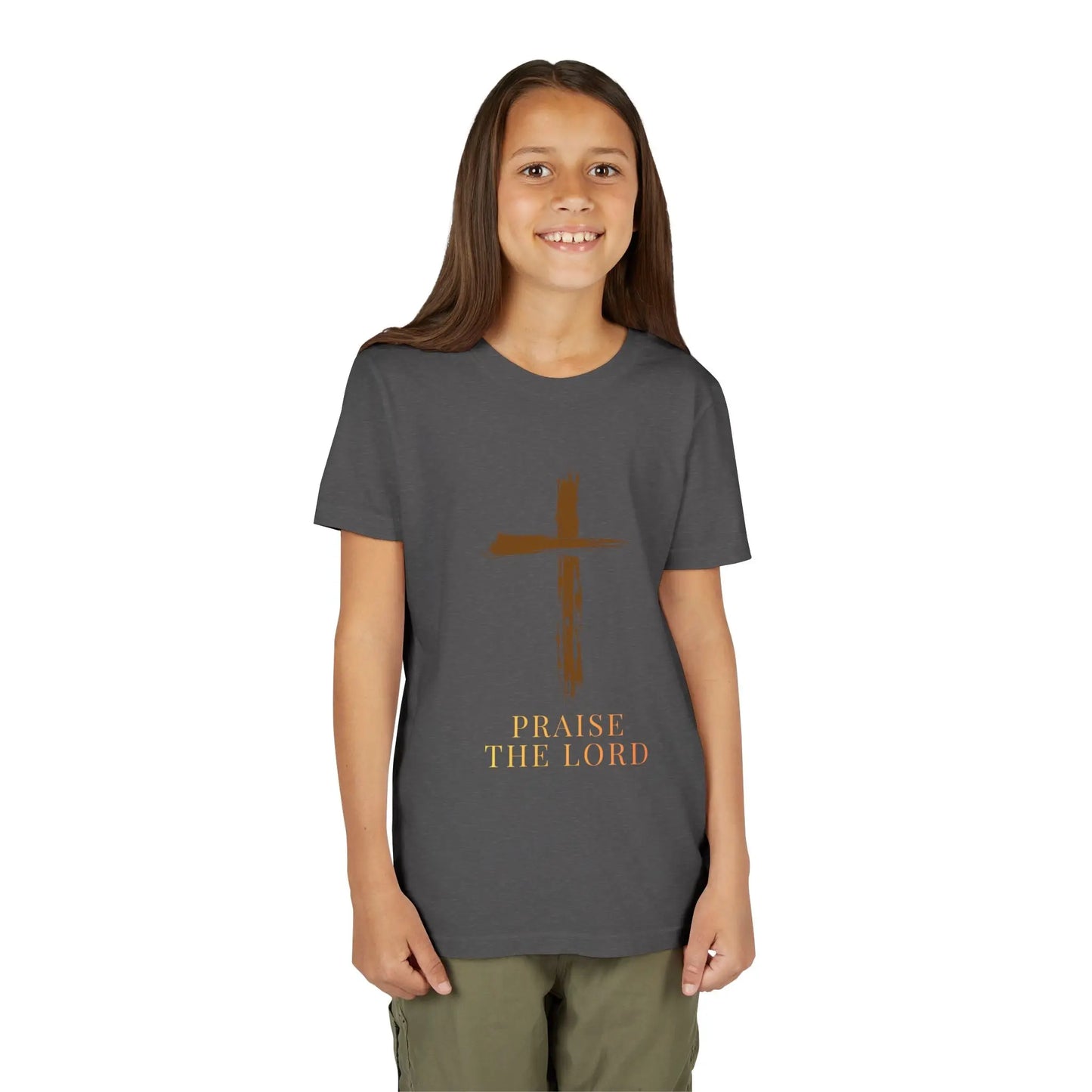 Girl wearing a soft, faith-inspired youth tee featuring a painterly brushstroke cross and "Praise The Lord." Perfect for church, Sunday school, Easter, and everyday Christian wear.Dark Heather Grey