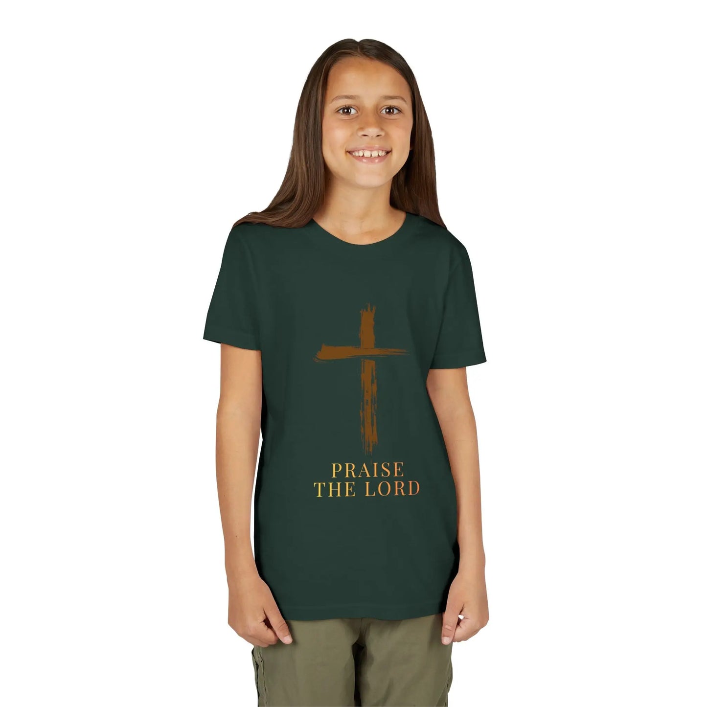 Young girl wearing a soft, faith-inspired youth tee featuring a painterly brushstroke cross and "Praise The Lord." Perfect for church, Sunday school, Easter, and everyday Christian wear.  Forest