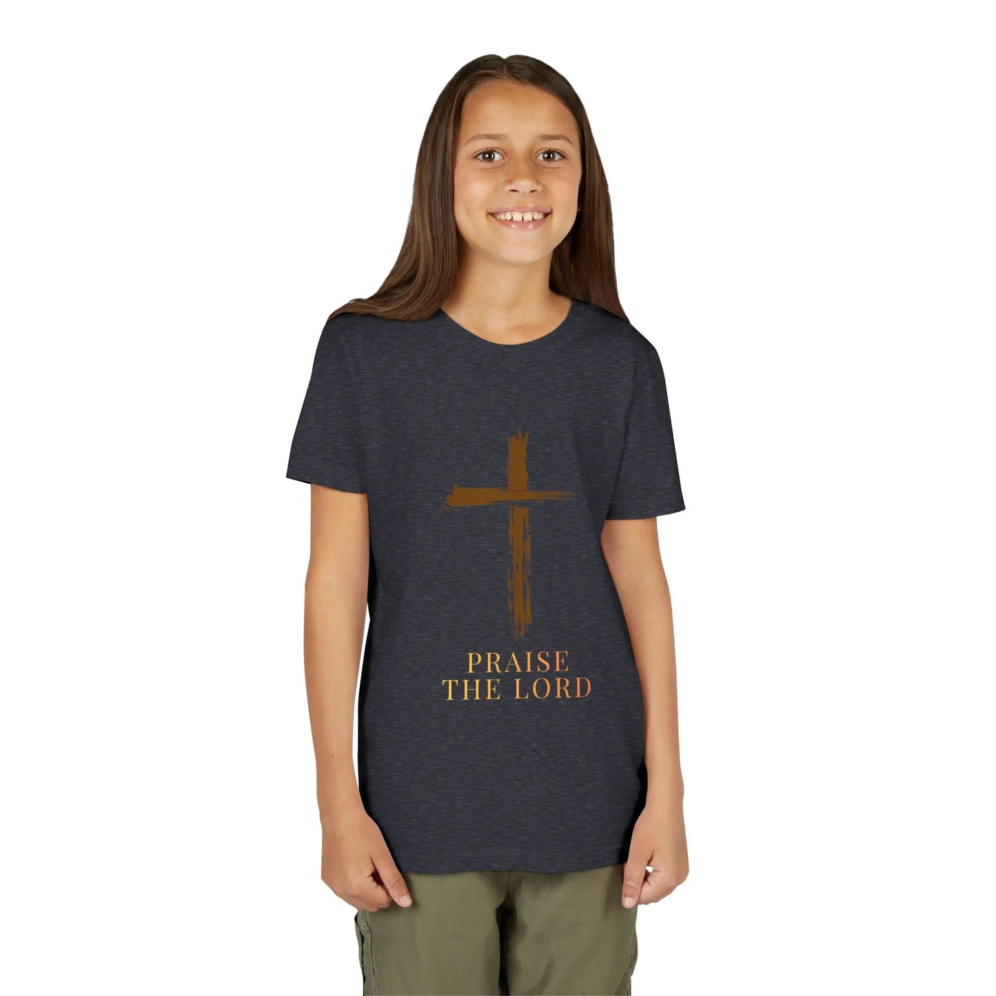 Girl wearing a Girl wearing a soft, faith-inspired youth tee featuring a painterly brushstroke cross and "Praise The Lord." Perfect for church, Sunday school, Easter, and everyday Christian wear. Heather Navy