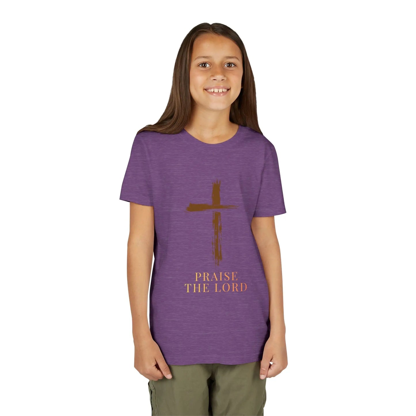 Girl wearing a soft, faith-inspired youth tee featuring a painterly brushstroke cross and "Praise The Lord." Perfect for church, Sunday school, Easter, and everyday Christian wear.  Heather Team Purple