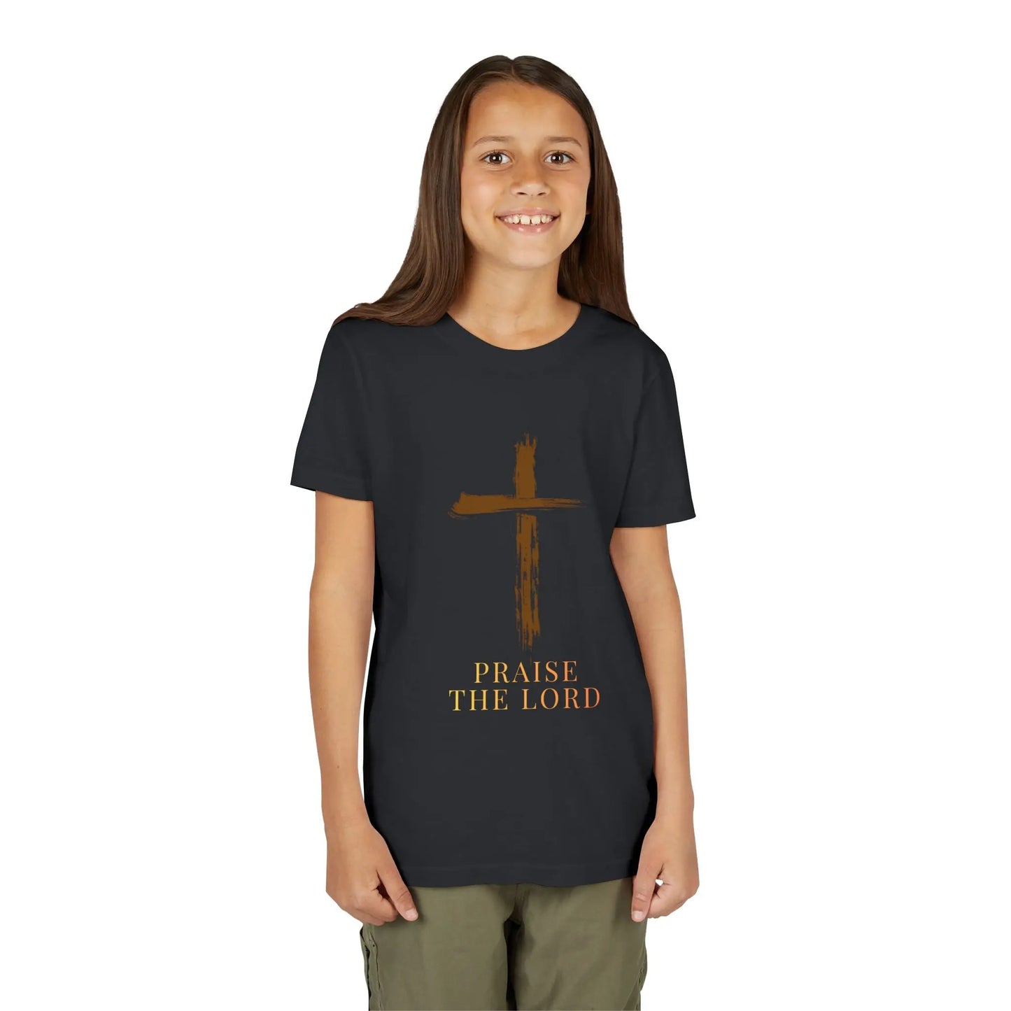 Girl wearing a soft, faith-inspired youth tee featuring a painterly brushstroke cross and "Praise The Lord." Perfect for church, Sunday school, Easter, and everyday Christian wear. Vintage Black