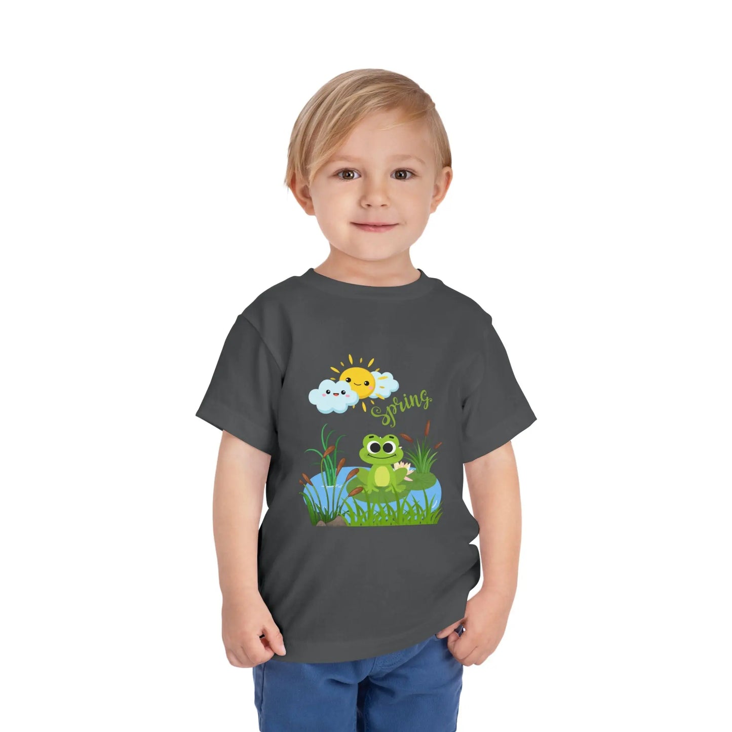 Toddler wearing an adorable toddler tee with spring frog pond graphic. Soft cotton, perfect for Easter, spring outfits, and playful adventures. Cute kids' clothing for toddlers. Asphalt