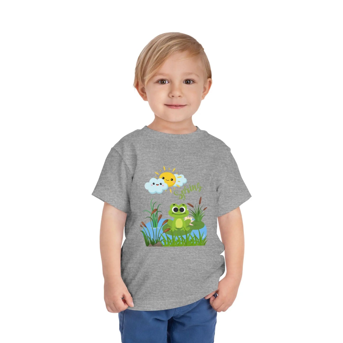 Toddler wearing an adorable toddler tee with spring frog pond graphic. Soft cotton, perfect for Easter, spring outfits, and playful adventures. Cute kids' clothing for toddlers. Athletic Heather
