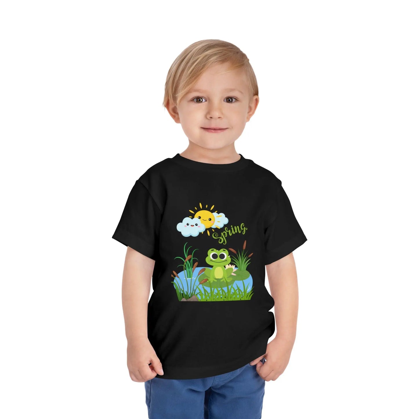 Toddler wearing an adorable toddler tee with spring frog pond graphic. Soft cotton, perfect for Easter, spring outfits, and playful adventures. Cute kids' clothing for toddlers. Black