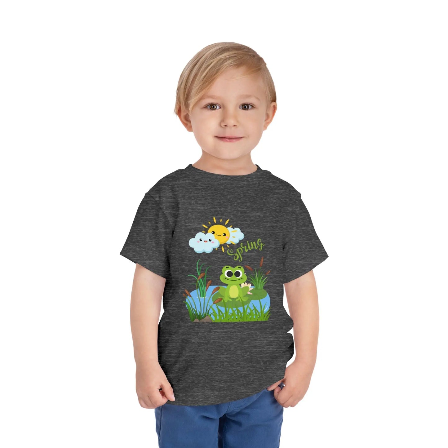 Toddler wearing an adorable toddler tee with spring frog pond graphic. Soft cotton, perfect for Easter, spring outfits, and playful adventures. Cute kids' clothing for toddlers. Deep Heather