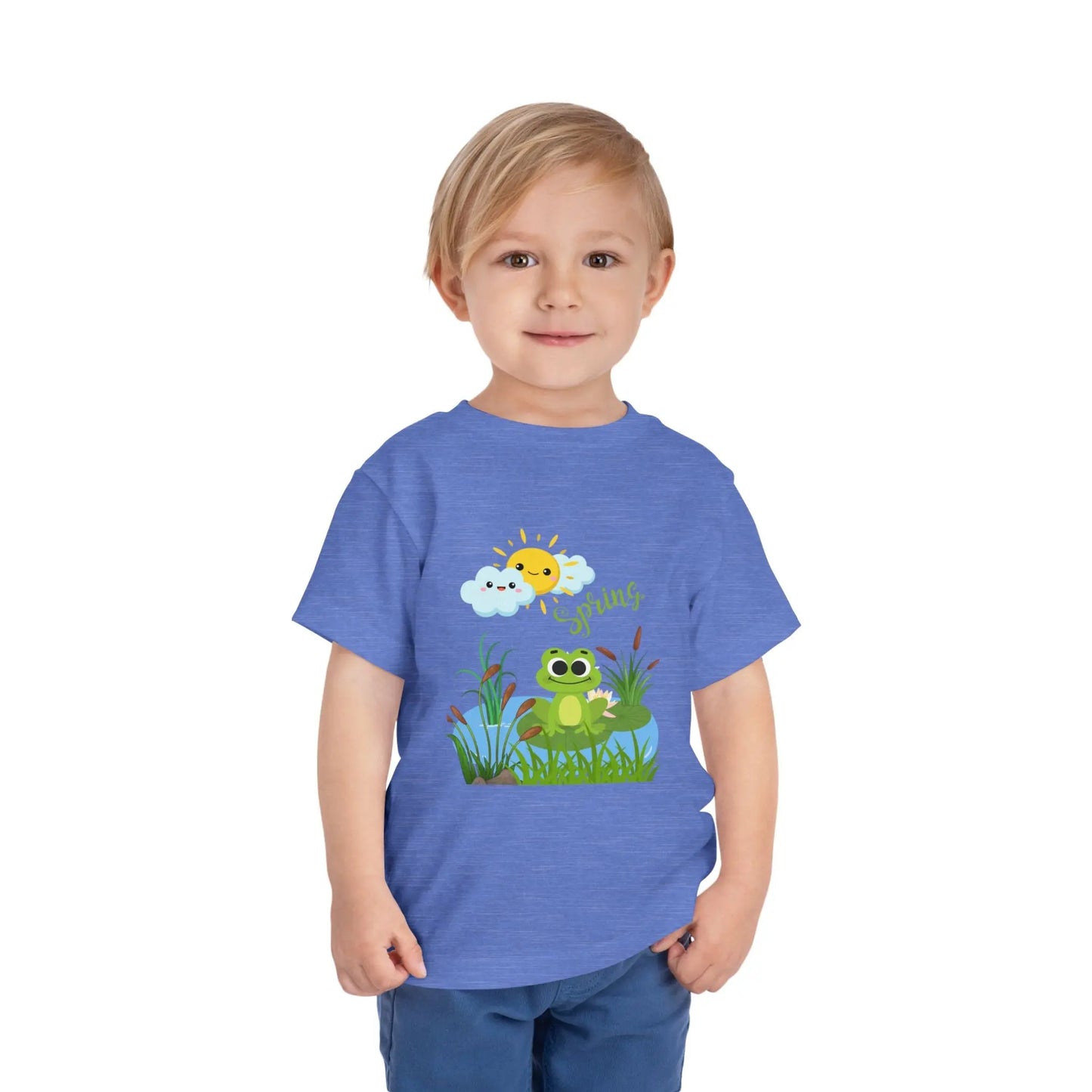 Toddler wearing an adorable toddler tee with spring frog pond graphic. Soft cotton, perfect for Easter, spring outfits, and playful adventures. Cute kids' clothing for toddlers. Heather Columbia Blue