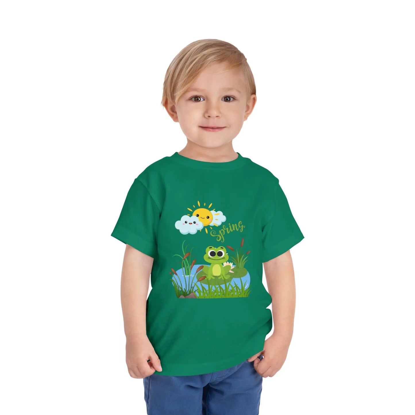 Toddler wearing an adorable toddler tee with spring frog pond graphic. Soft cotton, perfect for Easter, spring outfits, and playful adventures. Cute kids' clothing for toddlers. Kelly Green