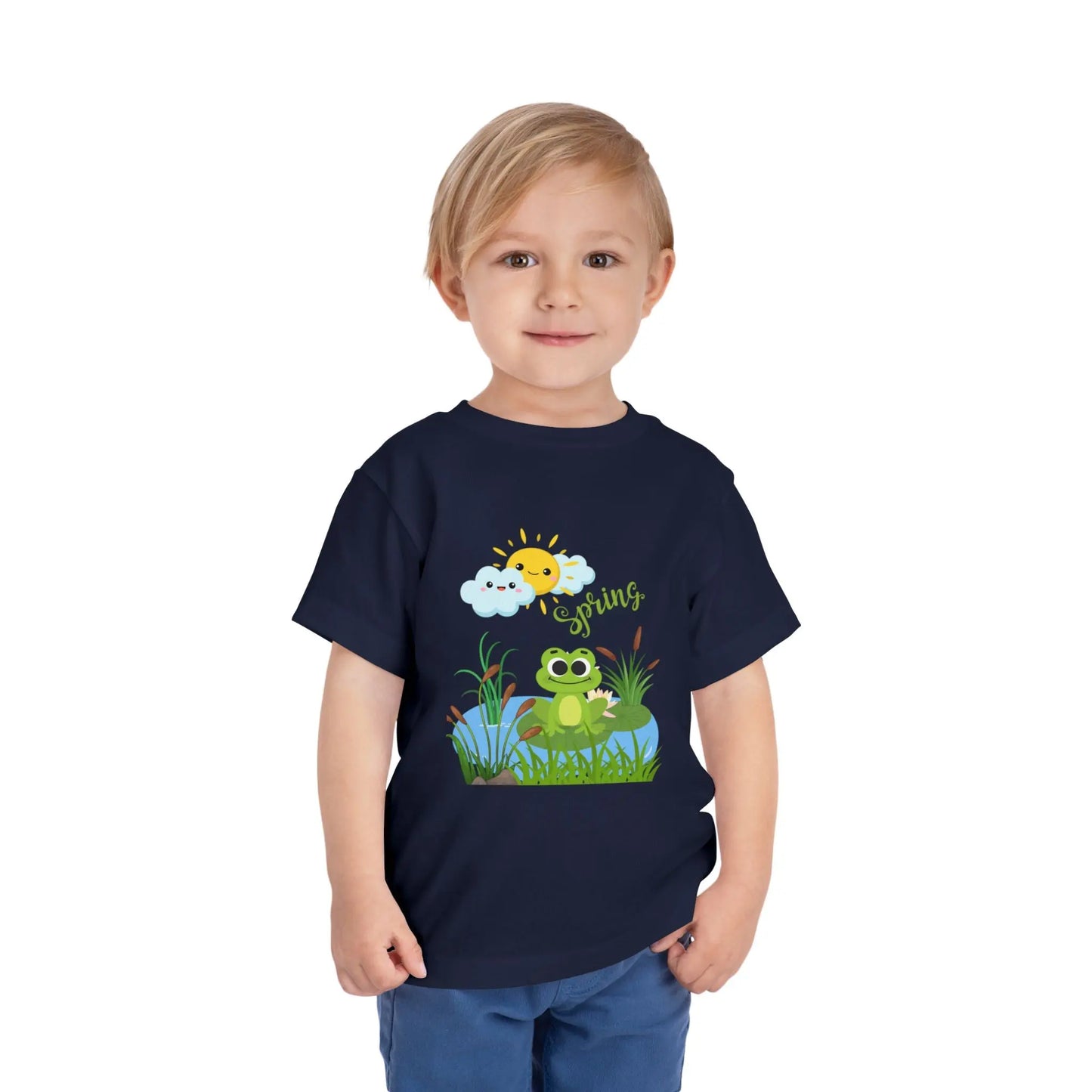 Toddler wearing an adorable toddler tee with spring frog pond graphic. Soft cotton, perfect for Easter, spring outfits, and playful adventures. Cute kids' clothing for toddlers. Navy