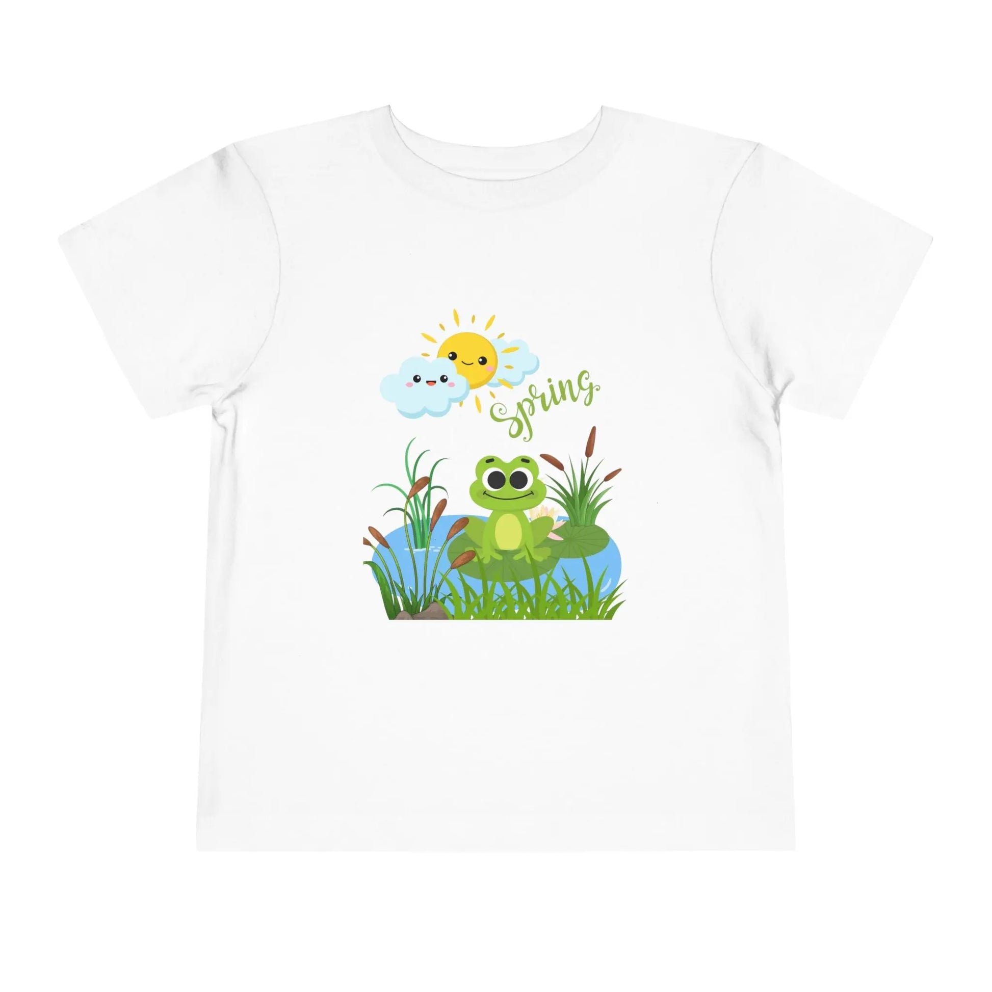 Toddler wearing an adorable toddler tee with spring frog pond graphic. Soft cotton, perfect for Easter, spring outfits, and playful adventures. Cute kids' clothing for toddlers. White