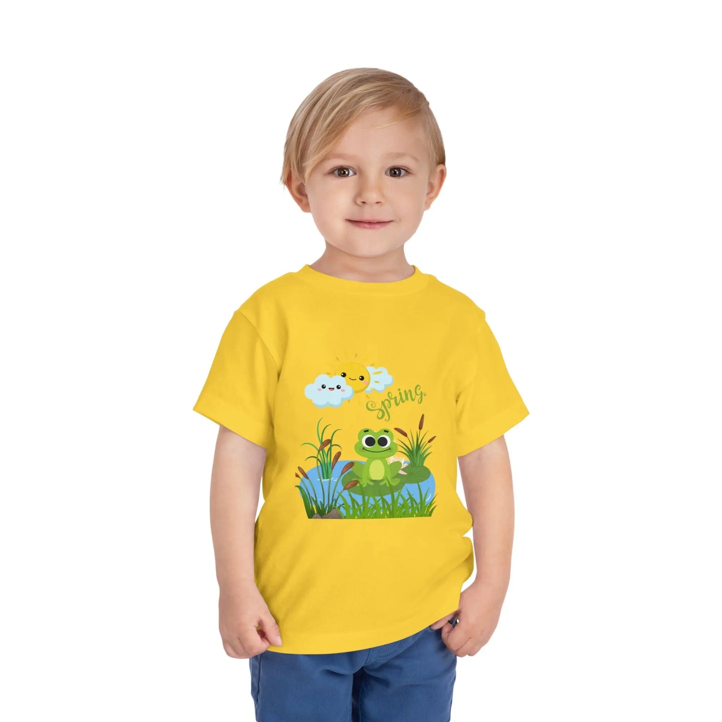 Toddler wearing an adorable toddler tee with spring frog pond graphic. Soft cotton, perfect for Easter, spring outfits, and playful adventures. Cute kids' clothing for toddlers. Yellow