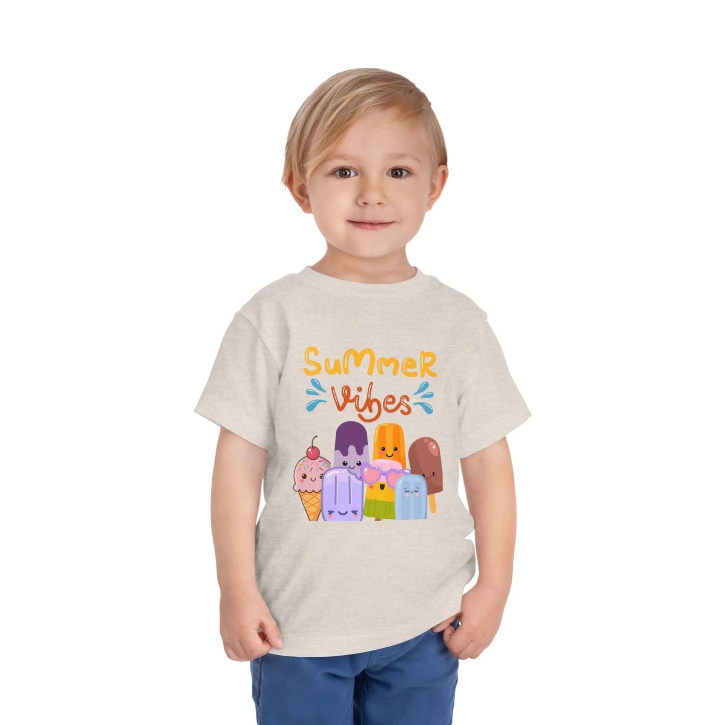Toddler wearing a soft toddler tee with a cheerful popsicle & ice cream Summer Vibes design. Lightweight cotton, sizes 2T–5T. Perfect for summer outings & gifting.  Heather Dust