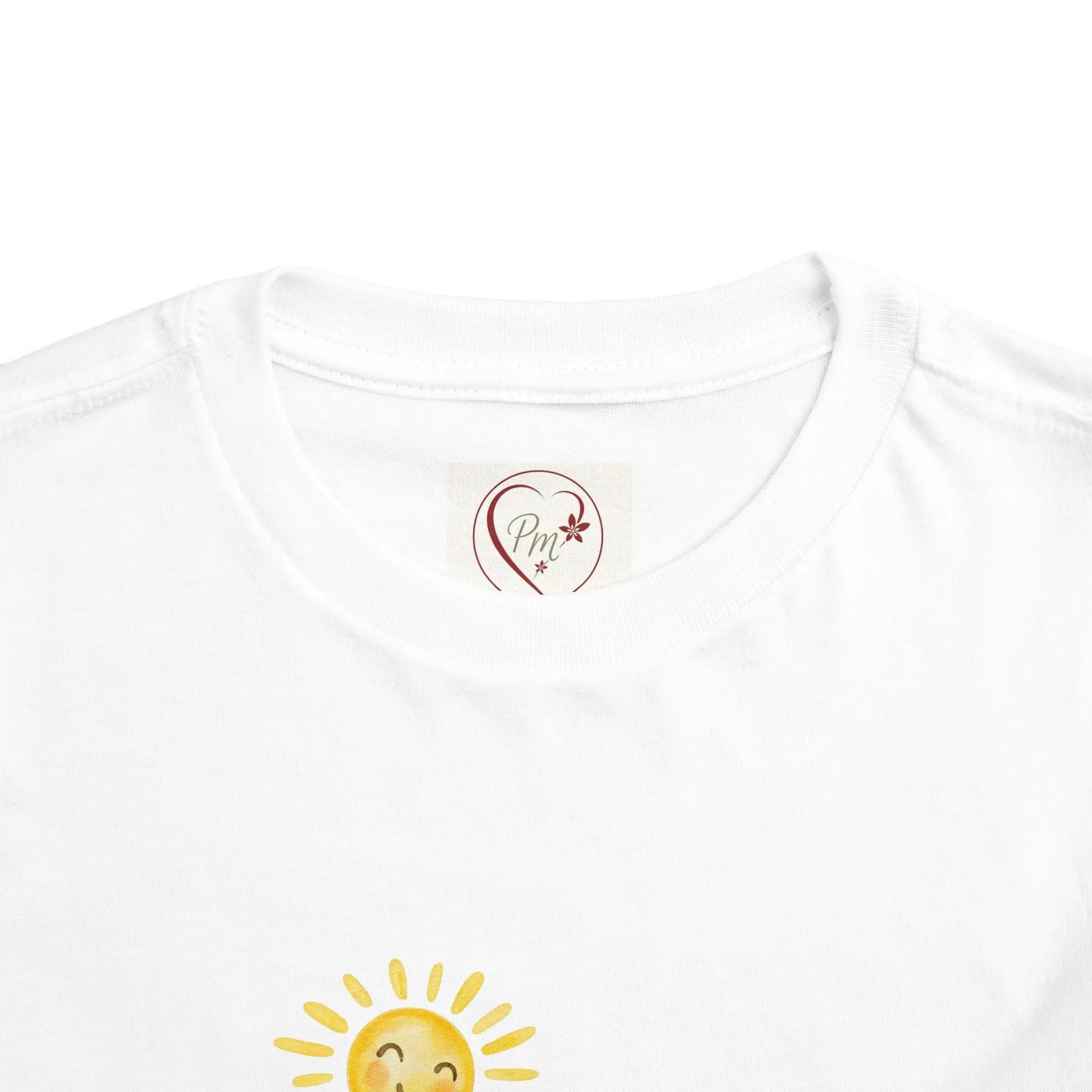 White t-shirt with a heart and sun design on a white background with a PM Creations 25 Logo
