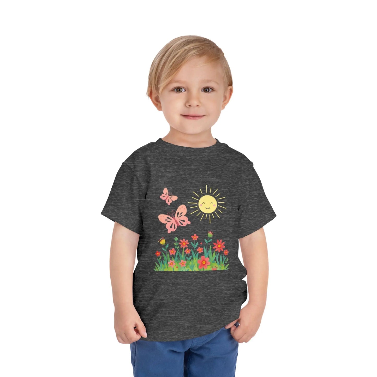 Toddler wearing a cheerful toddler tee with smiling sun, butterflies, and wildflowers. Soft cotton, perfect for spring, playdates, and outdoor adventures. Bright kids' clothing. Deep Heather