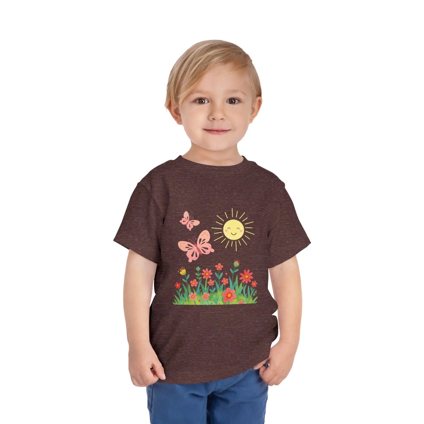Toddler wearing a cheerful toddler tee with smiling sun, butterflies, and wildflowers. Soft cotton, perfect for spring, playdates, and outdoor adventures. Bright kids' clothing. Heather Mauve
