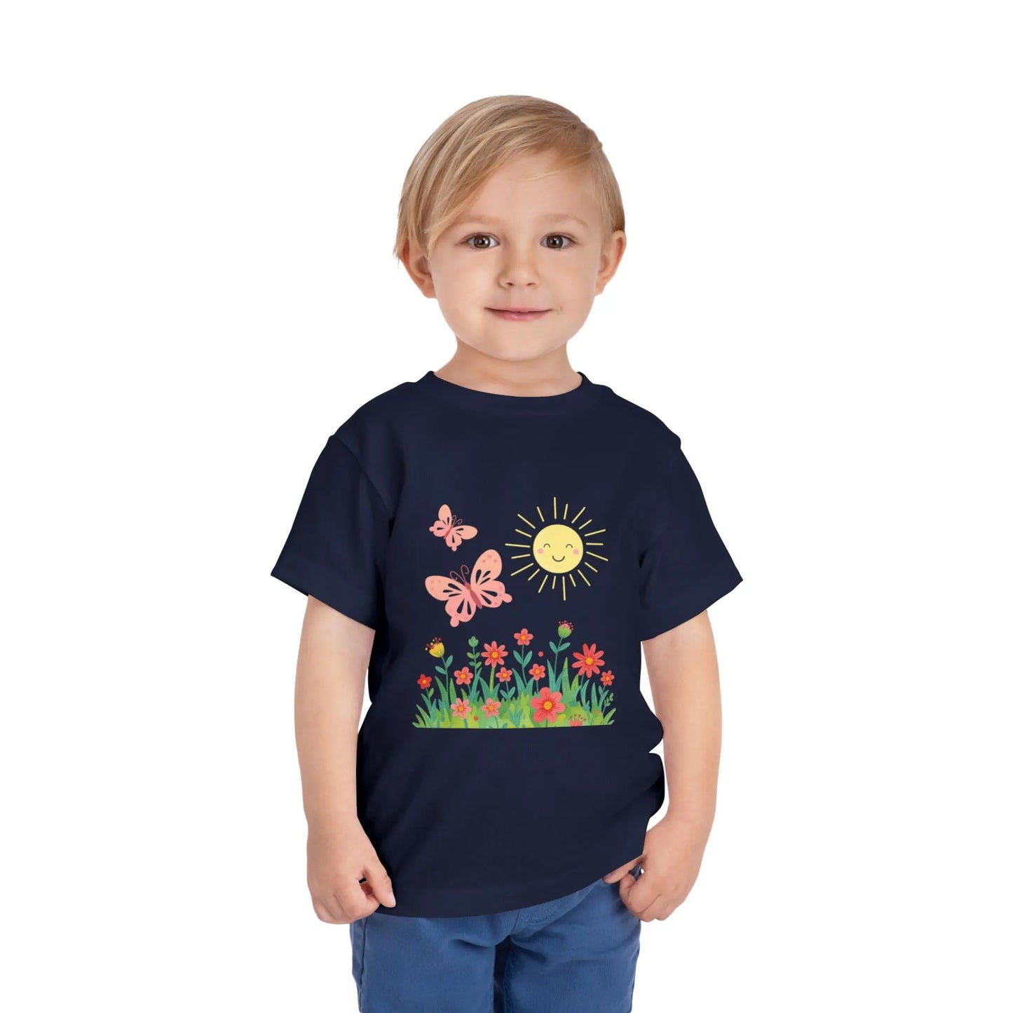Toddler wearing a cheerful toddler tee with smiling sun, butterflies, and wildflowers. Soft cotton, perfect for spring, playdates, and outdoor adventures. Bright kids' clothing. Navy