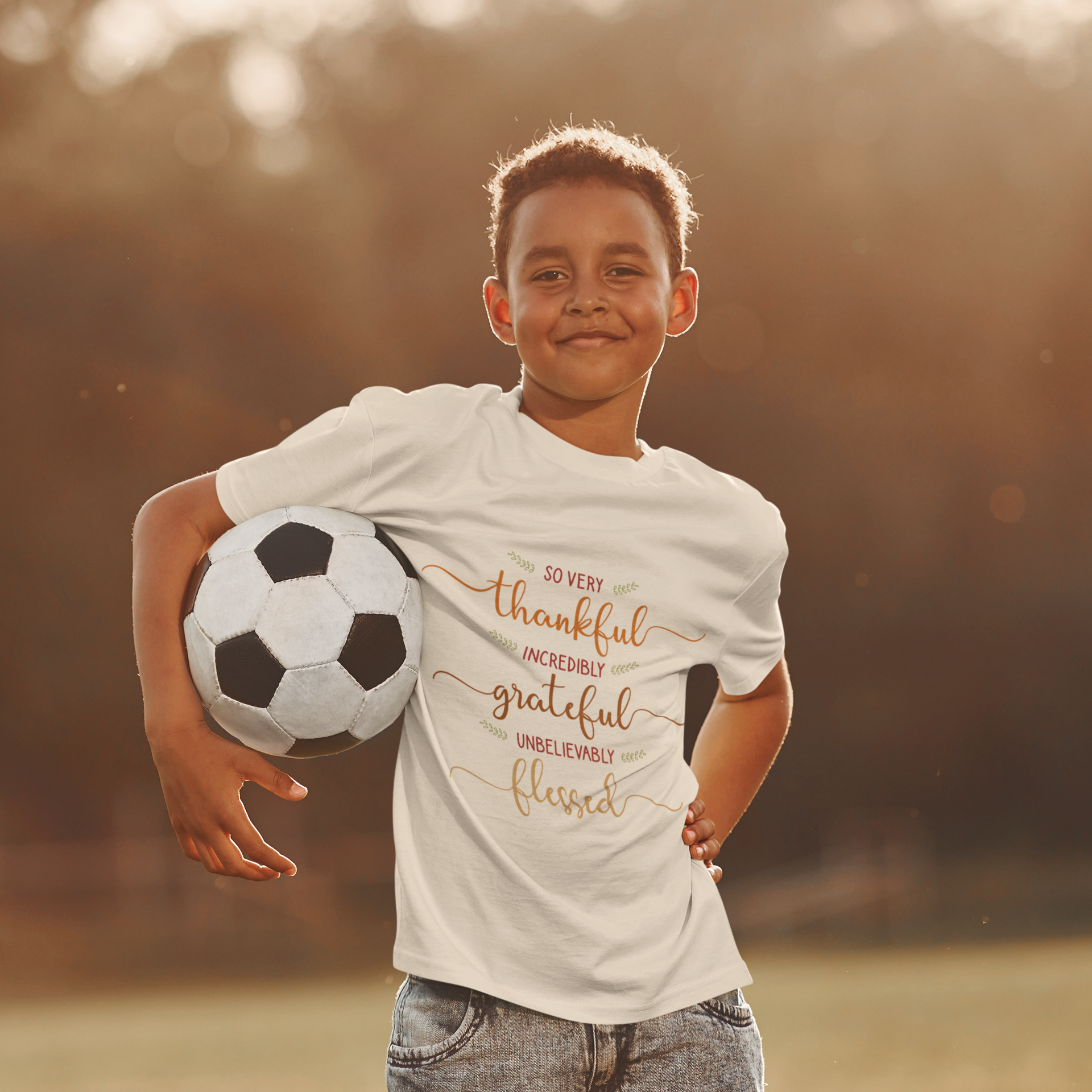 Youth wearing a heartfelt youth tee with "Thankful, Grateful, Blessed" message. Soft cotton, perfect for Thanksgiving, family photos, and everyday gratitude. Inspirational kids' clothing.