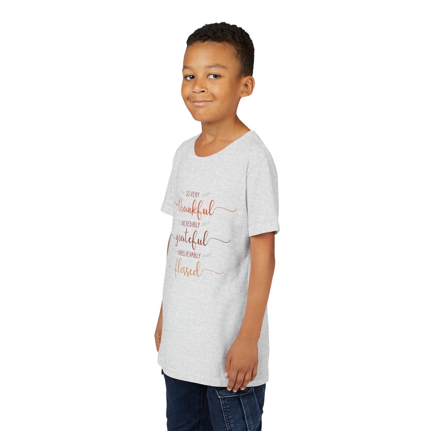 Youth wearing a heartfelt youth tee with "Thankful, Grateful, Blessed" message. Soft cotton, perfect for Thanksgiving, family photos, and everyday gratitude. Inspirational kids' clothing. Ash