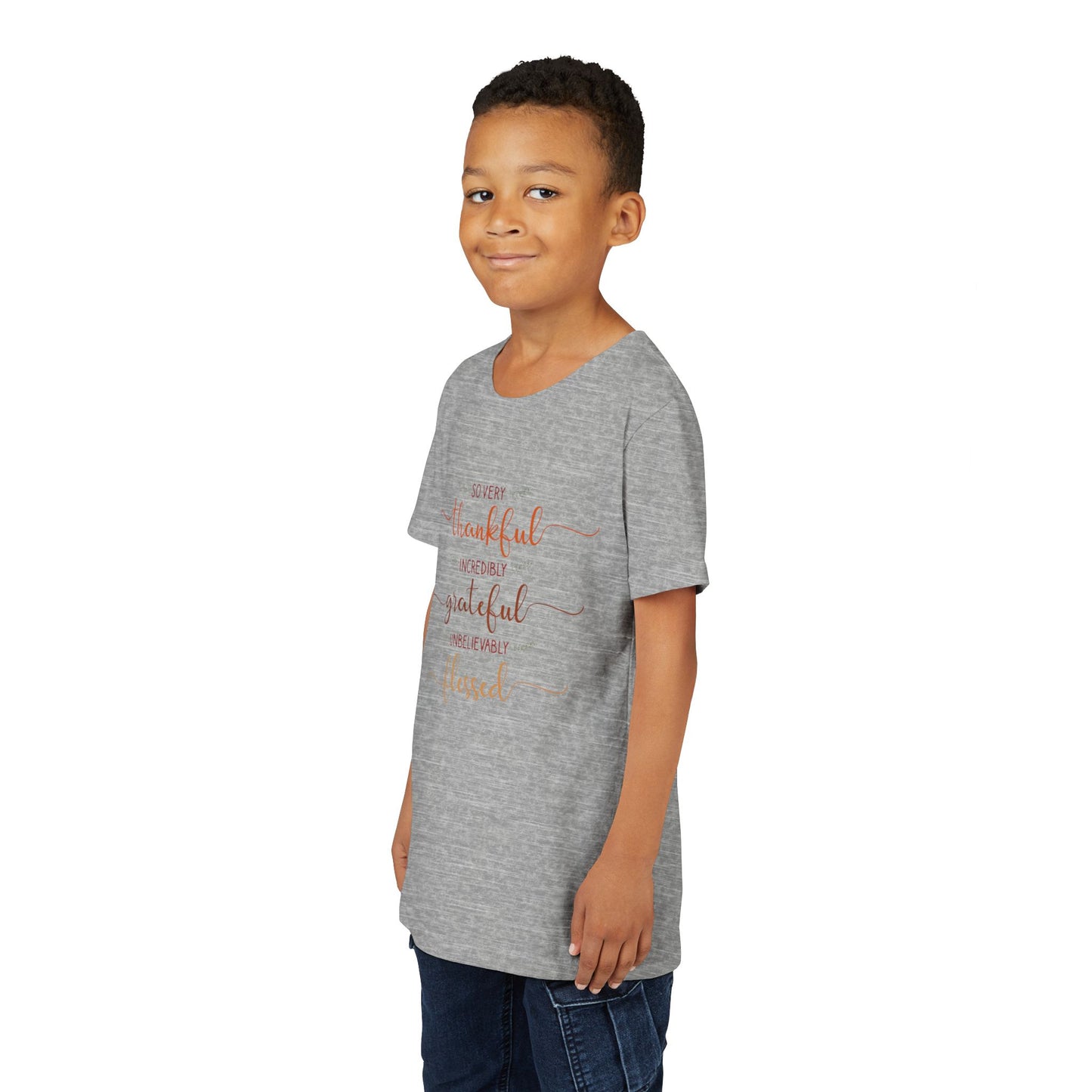 Youth wearing a heartfelt youth tee with "Thankful, Grateful, Blessed" message. Soft cotton, perfect for Thanksgiving, family photos, and everyday gratitude. Inspirational kids' clothing. Athletic Heather