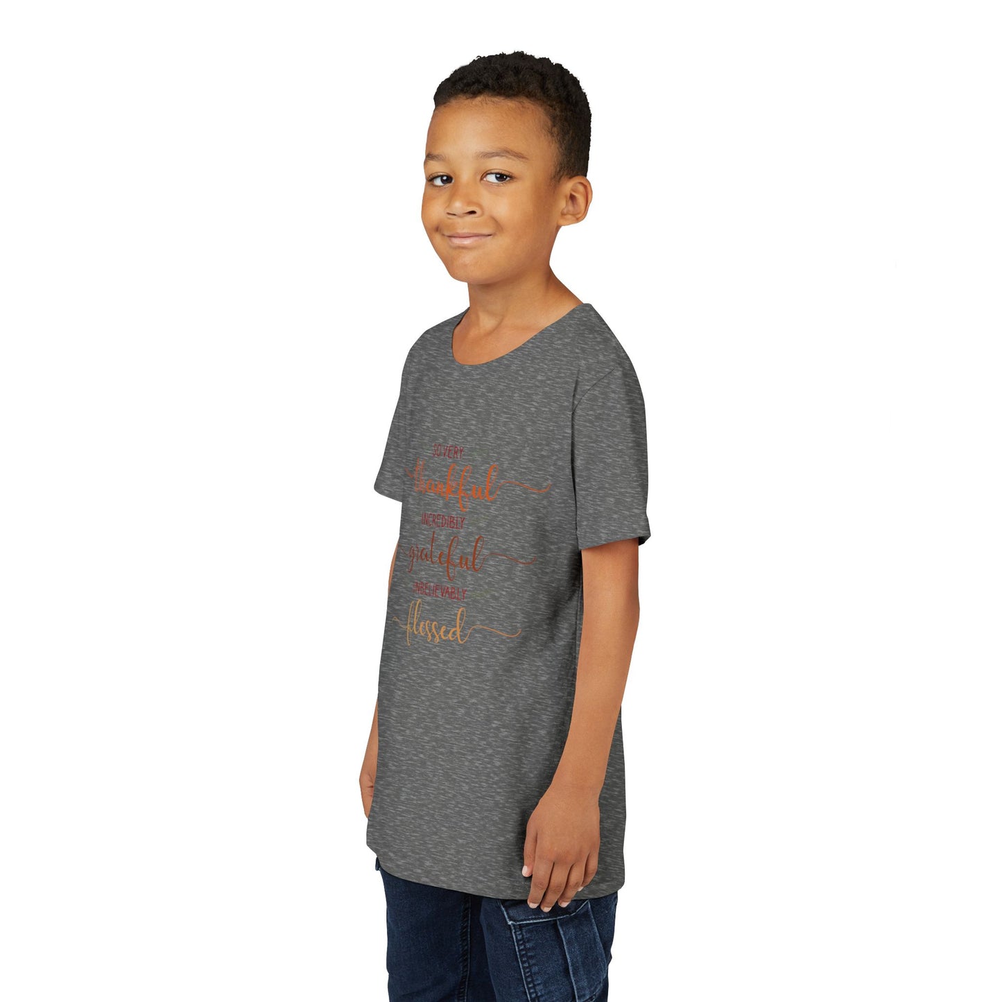 Youth wearing a heartfelt youth tee with "Thankful, Grateful, Blessed" message. Soft cotton, perfect for Thanksgiving, family photos, and everyday gratitude. Inspirational kids' clothing. Deep Heather