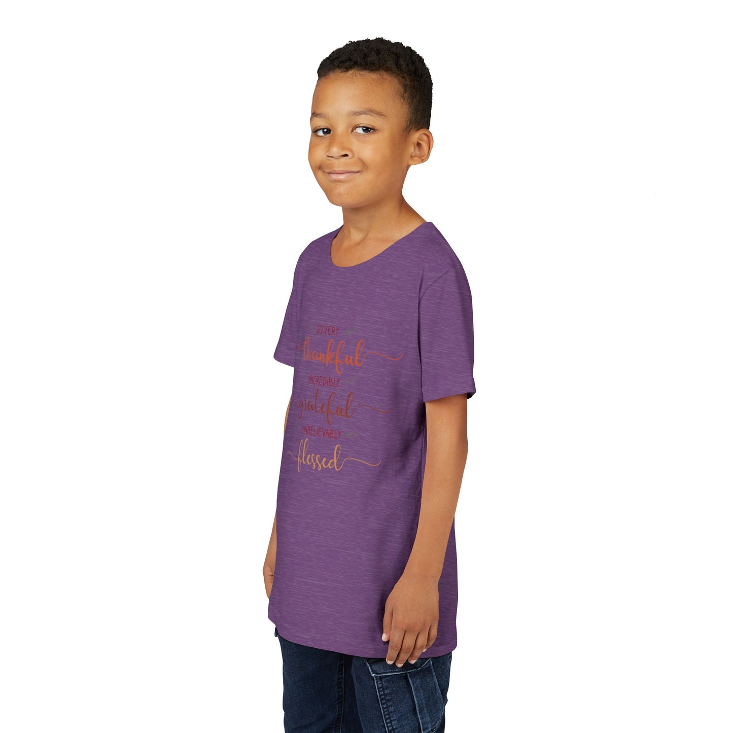 Youth wearing a heartfelt youth tee with "Thankful, Grateful, Blessed" message. Soft cotton, perfect for Thanksgiving, family photos, and everyday gratitude. Inspirational kids' clothing. Heather Team Purple