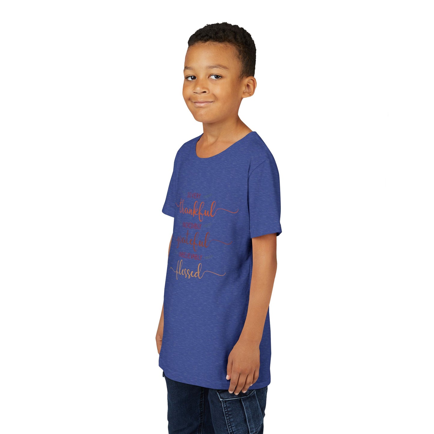 Youth wearing a heartfelt youth tee with "Thankful, Grateful, Blessed" message. Soft cotton, perfect for Thanksgiving, family photos, and everyday gratitude. Inspirational kids' clothing. Heather True Royal