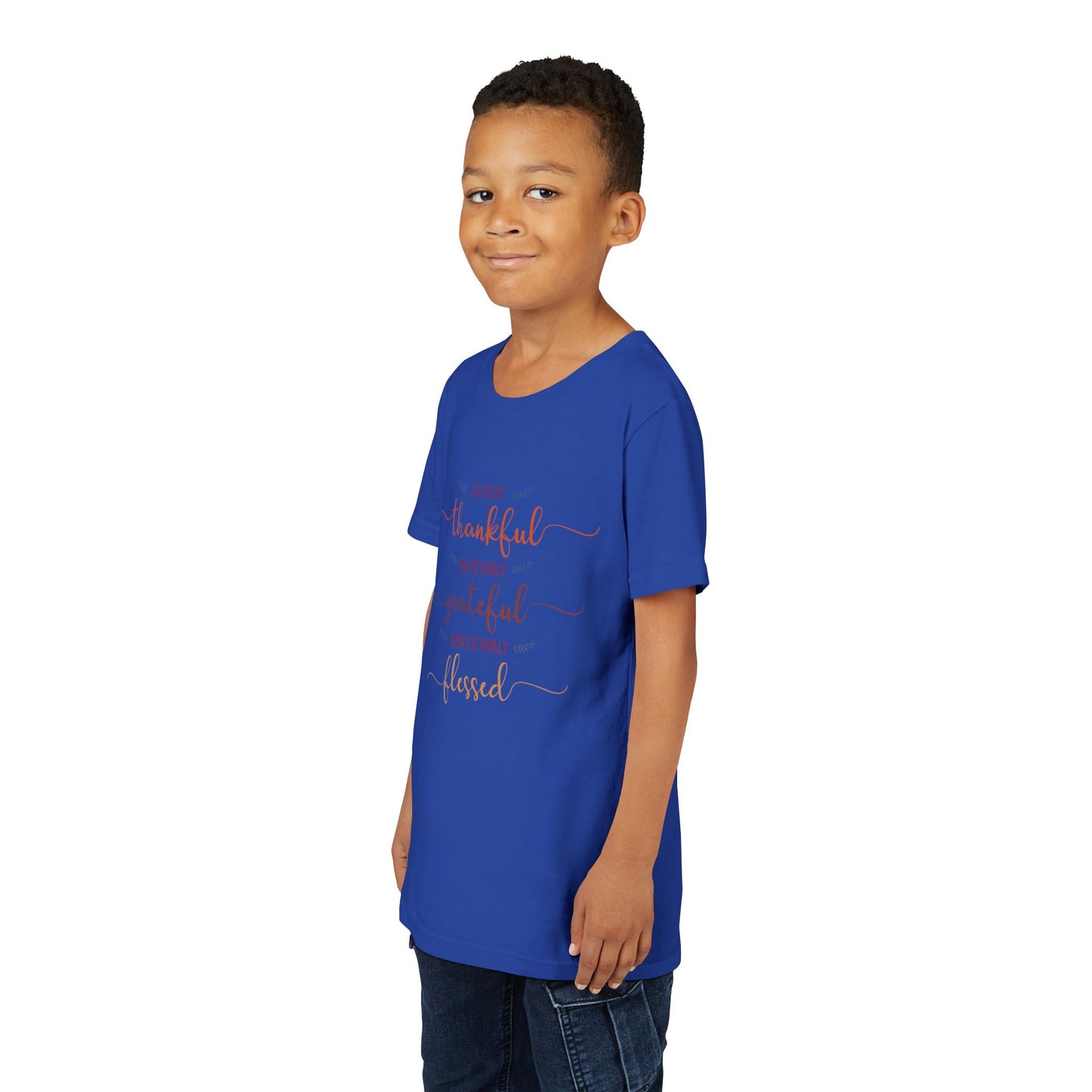 Youth wearing a heartfelt youth tee with "Thankful, Grateful, Blessed" message. Soft cotton, perfect for Thanksgiving, family photos, and everyday gratitude. Inspirational kids' clothing. True Royal