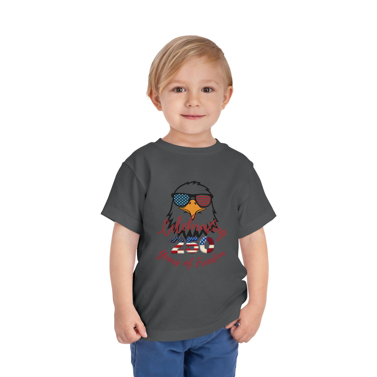 Celebrate America's 250th birthday in style! This soft Bella Canvas toddler tee features a patriotic eagle in American-flag sunglasses. Perfect for 4th of July parades, cookouts & fireworks. Sizes 2T–5T. Asphalt