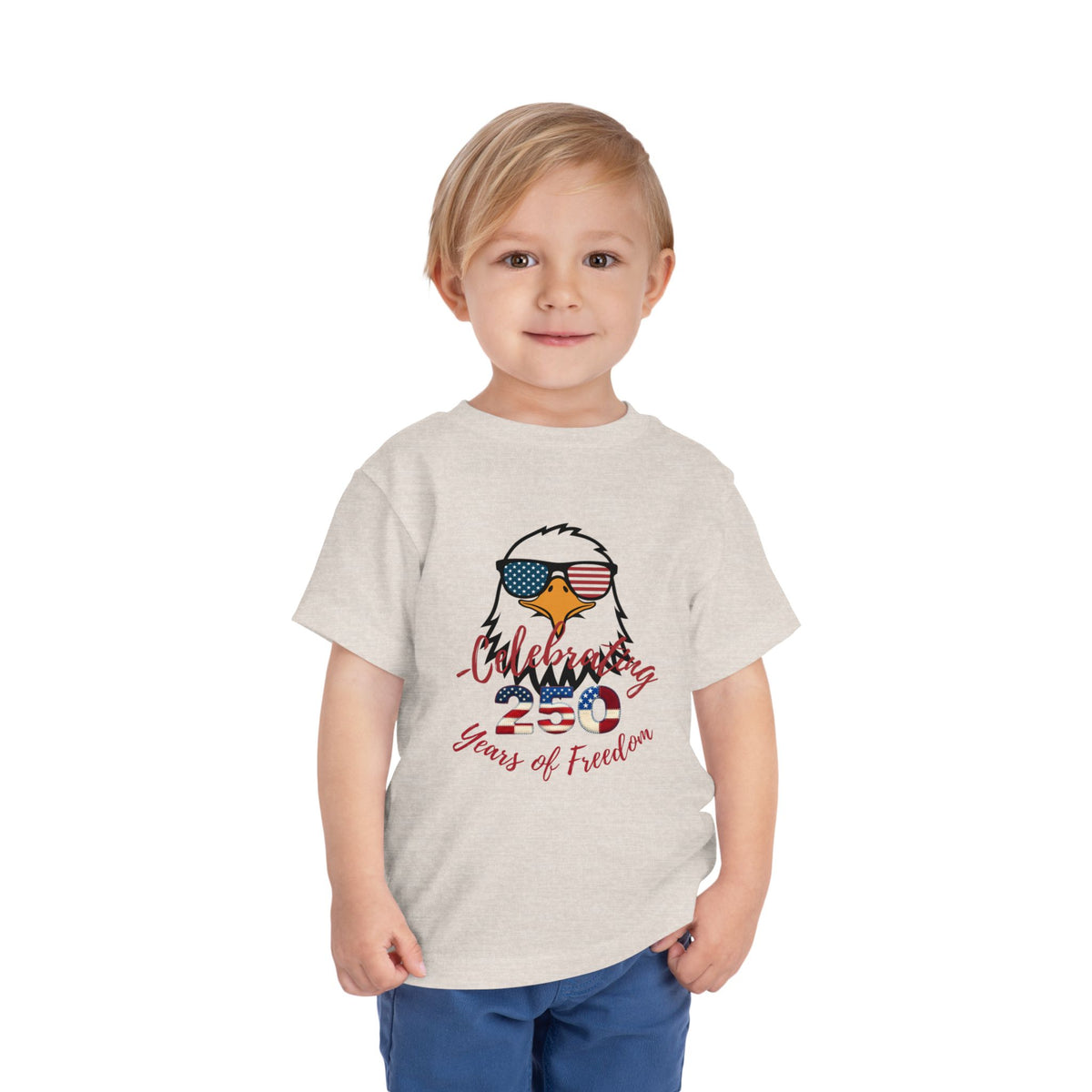 Celebrate America's 250th birthday in style! This soft Bella Canvas toddler tee features a patriotic eagle in American-flag sunglasses. Perfect for 4th of July parades, cookouts & fireworks. Sizes 2T–5T. Heather Dust