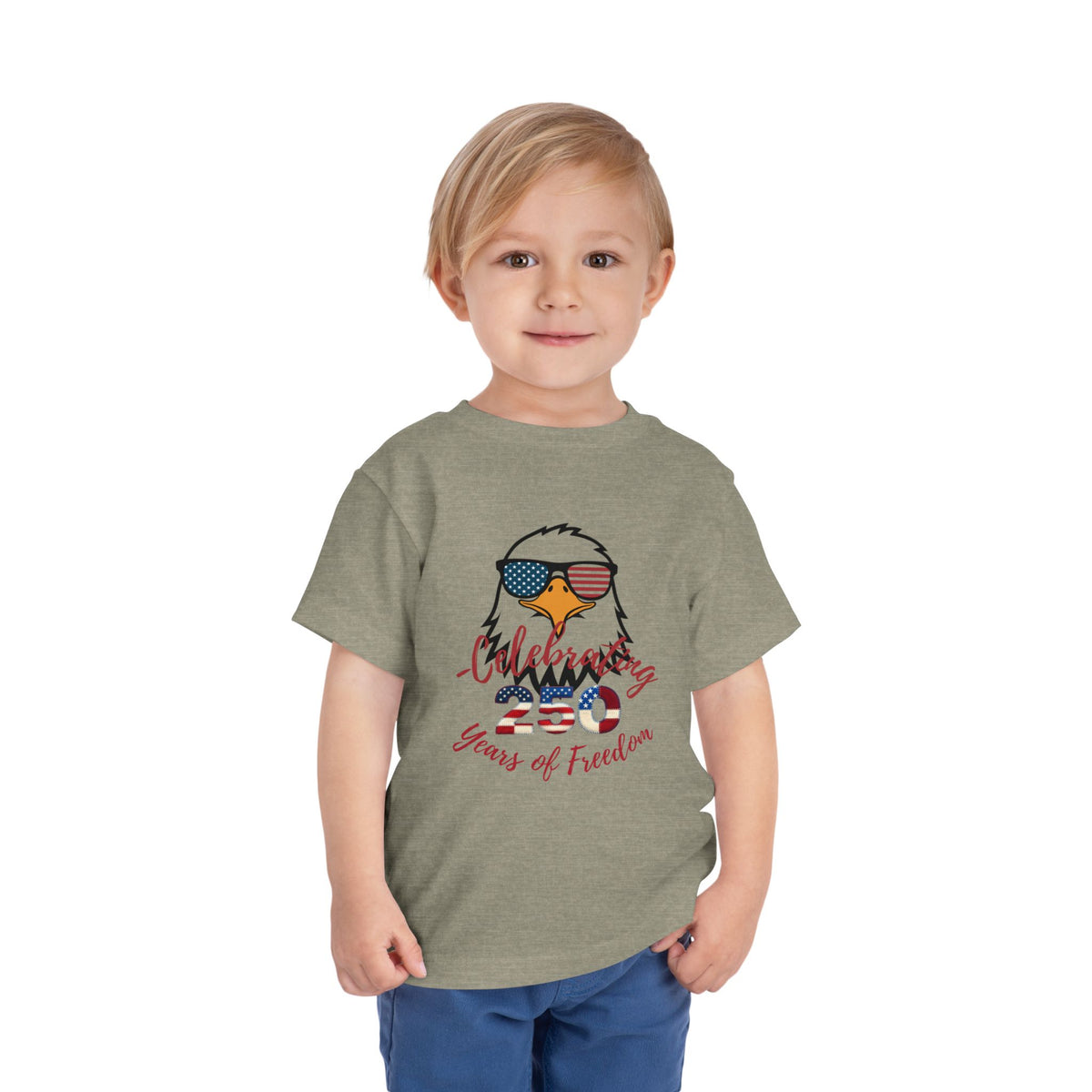 Celebrate America's 250th birthday in style! This soft Bella Canvas toddler tee features a patriotic eagle in American-flag sunglasses. Perfect for 4th of July parades, cookouts & fireworks. Sizes 2T–5T. Heather Stone