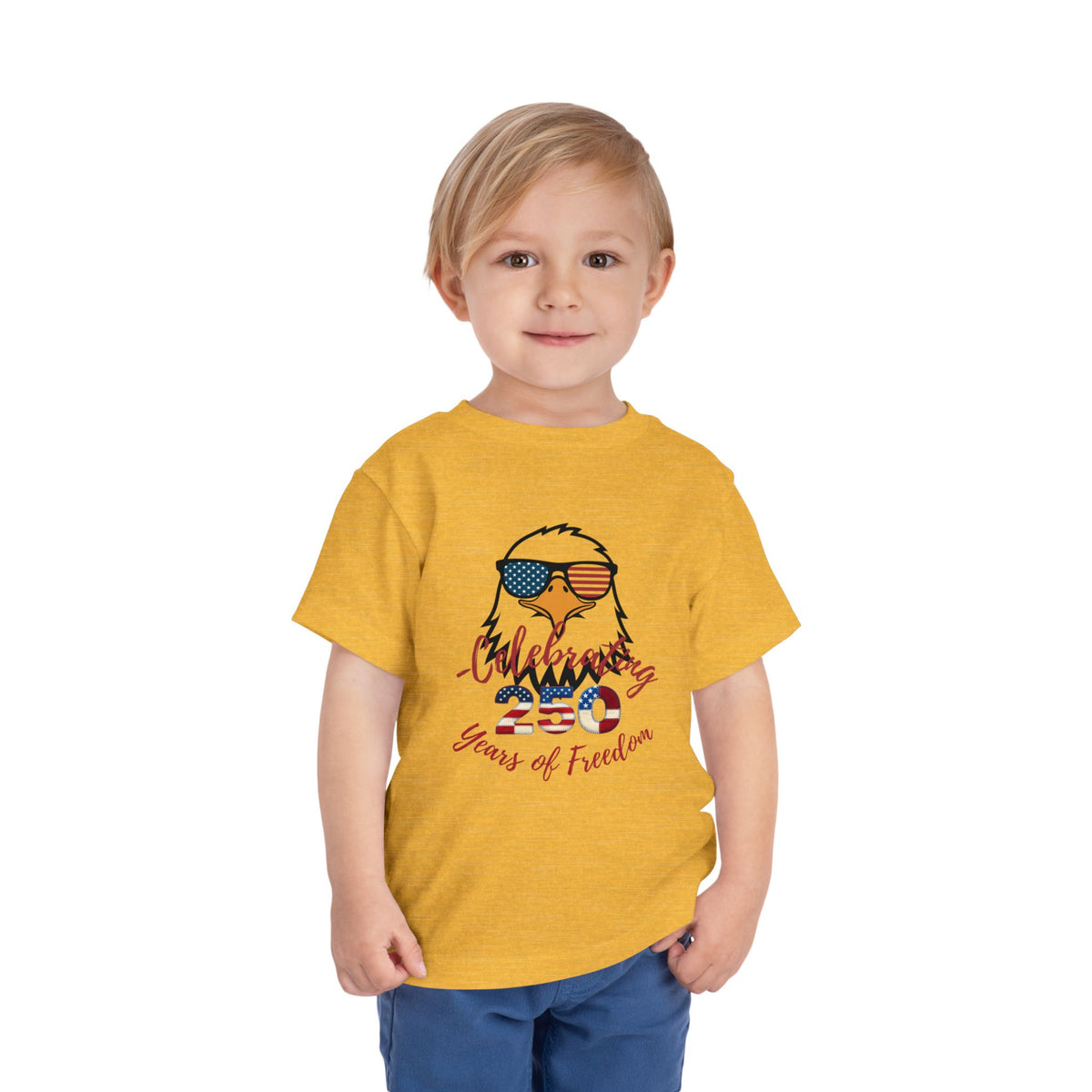 Celebrate America's 250th birthday in style! This soft Bella Canvas toddler tee features a patriotic eagle in American-flag sunglasses. Perfect for 4th of July parades, cookouts & fireworks. Sizes 2T–5T. Heather Yellow Gold