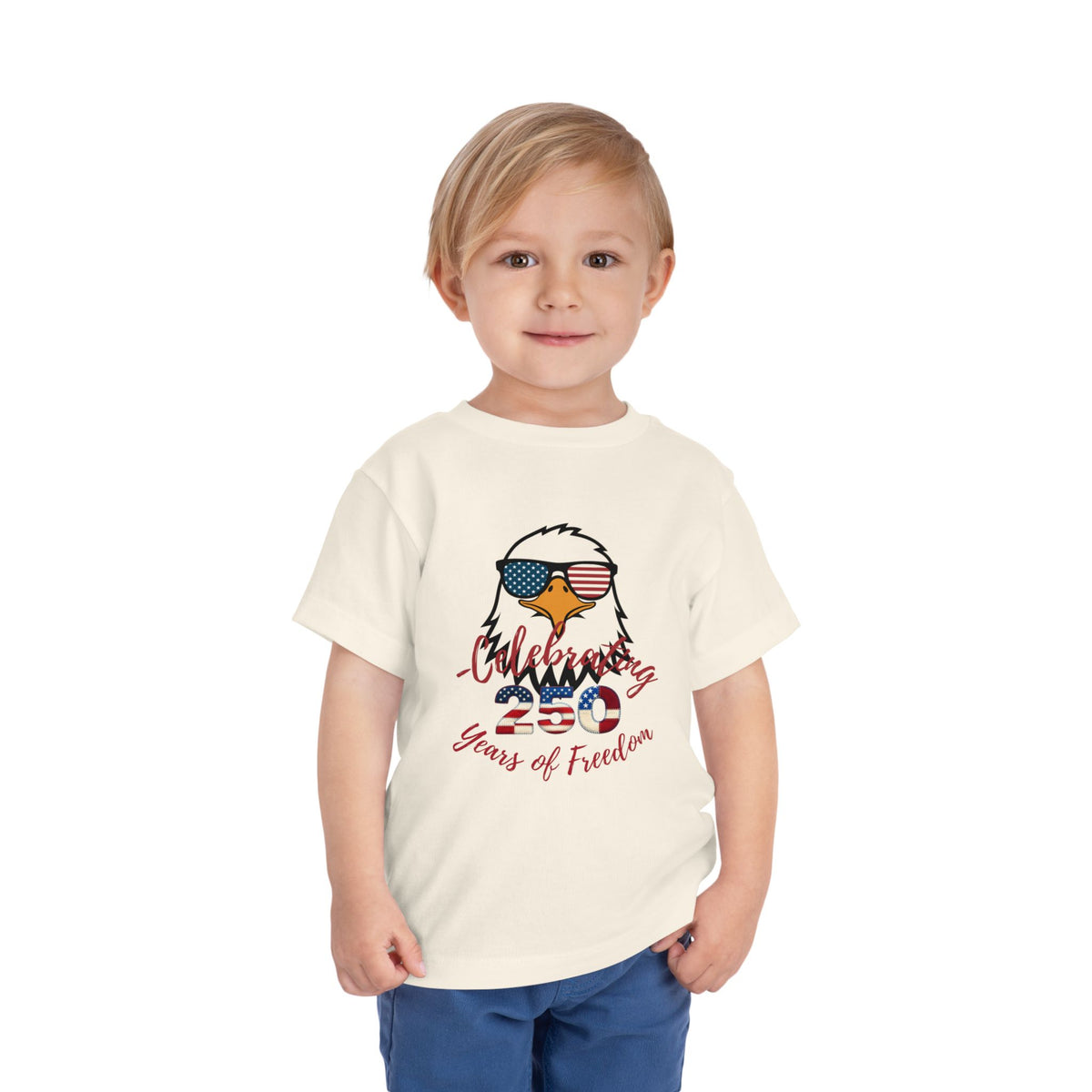 Celebrate America's 250th birthday in style! This soft Bella Canvas toddler tee features a patriotic eagle in American-flag sunglasses. Perfect for 4th of July parades, cookouts & fireworks. Sizes 2T–5T. Natural