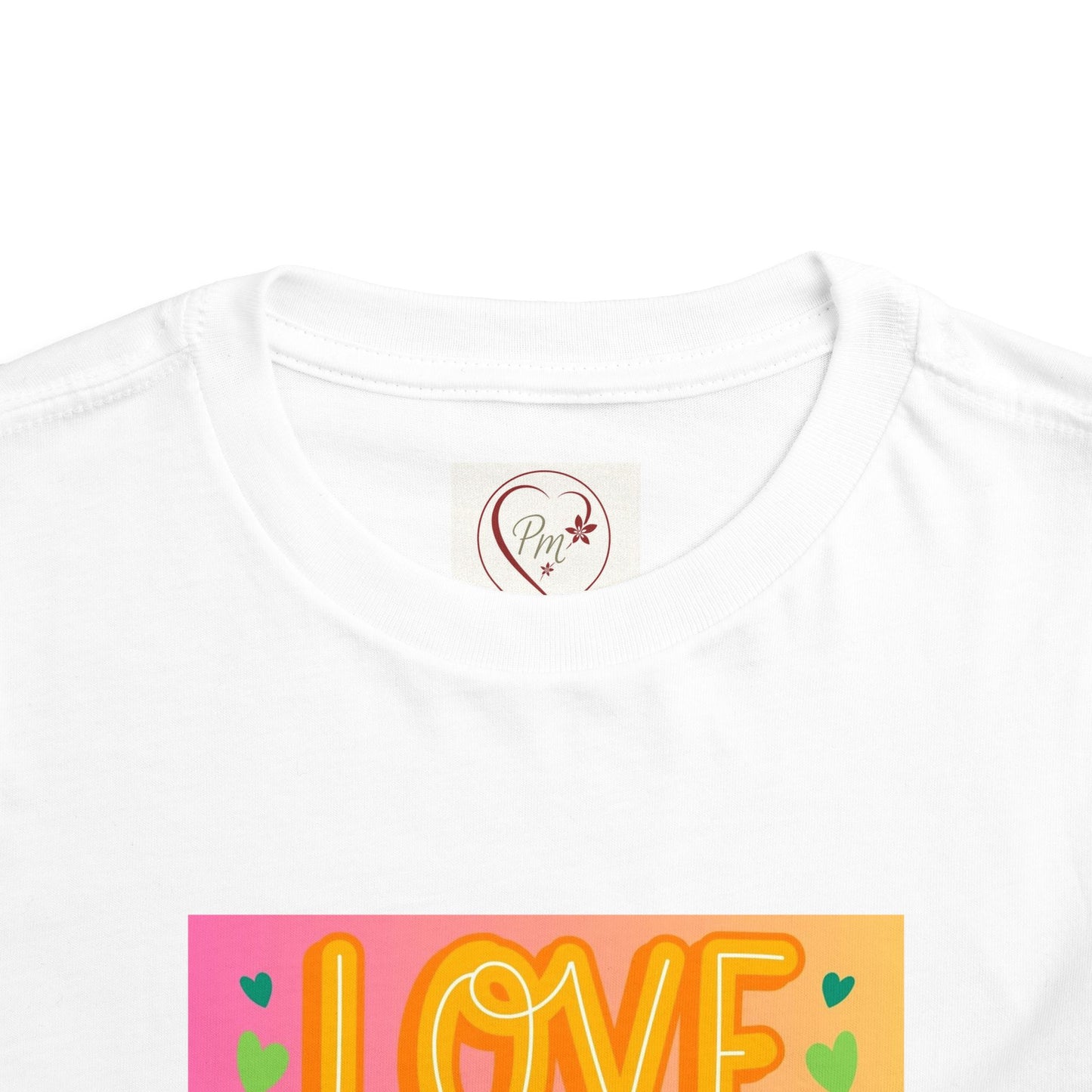 White t-shirt with 'I LOVE' design and a PM Creations 25 logo on a white background