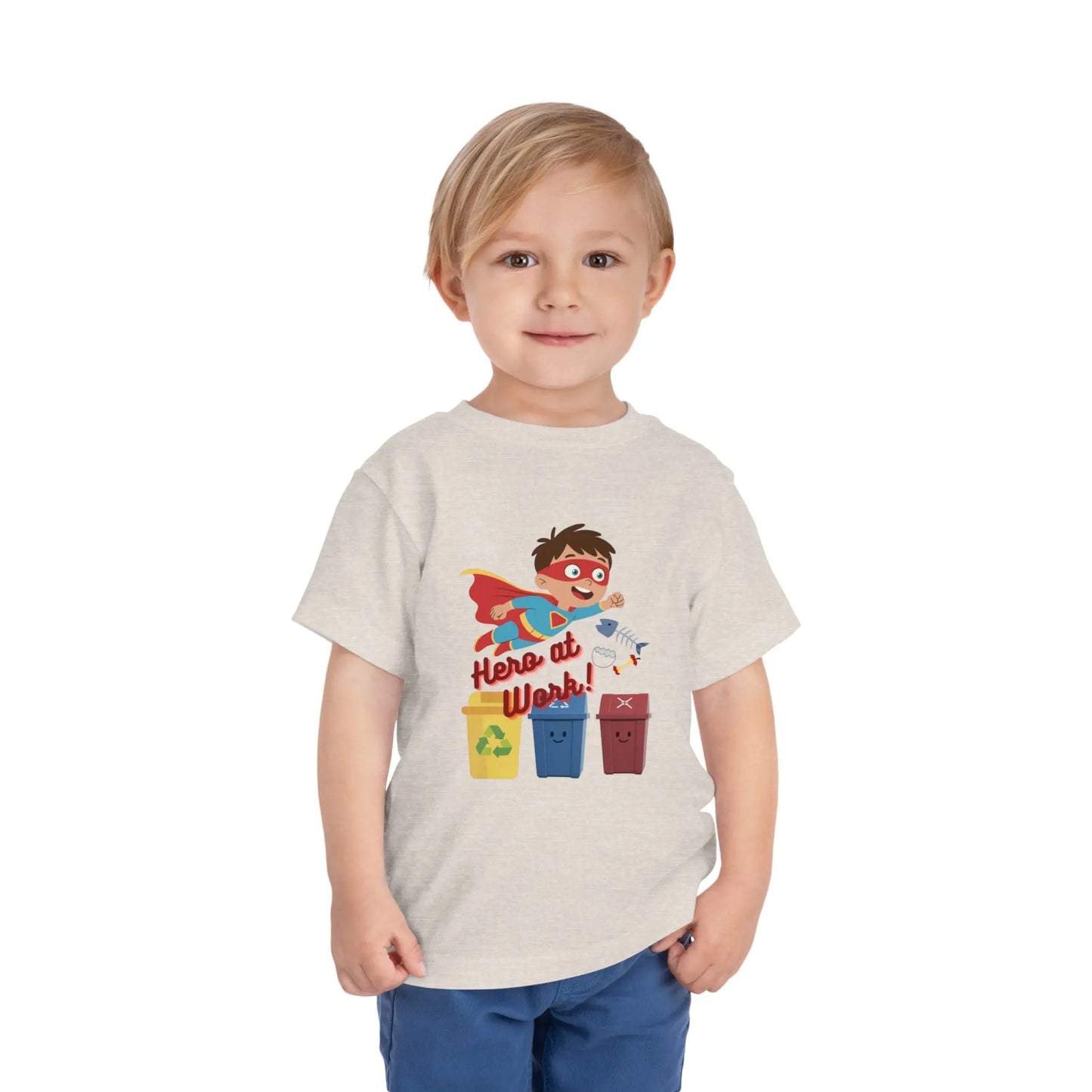 Toddler wearing these inspiring little eco-heroes with this playful toddler recycling shirt. Soft, durable cotton tee featuring a caped superhero sorting bin. Perfect for Earth Day, preschool, and everyday adventures. Heather Dust