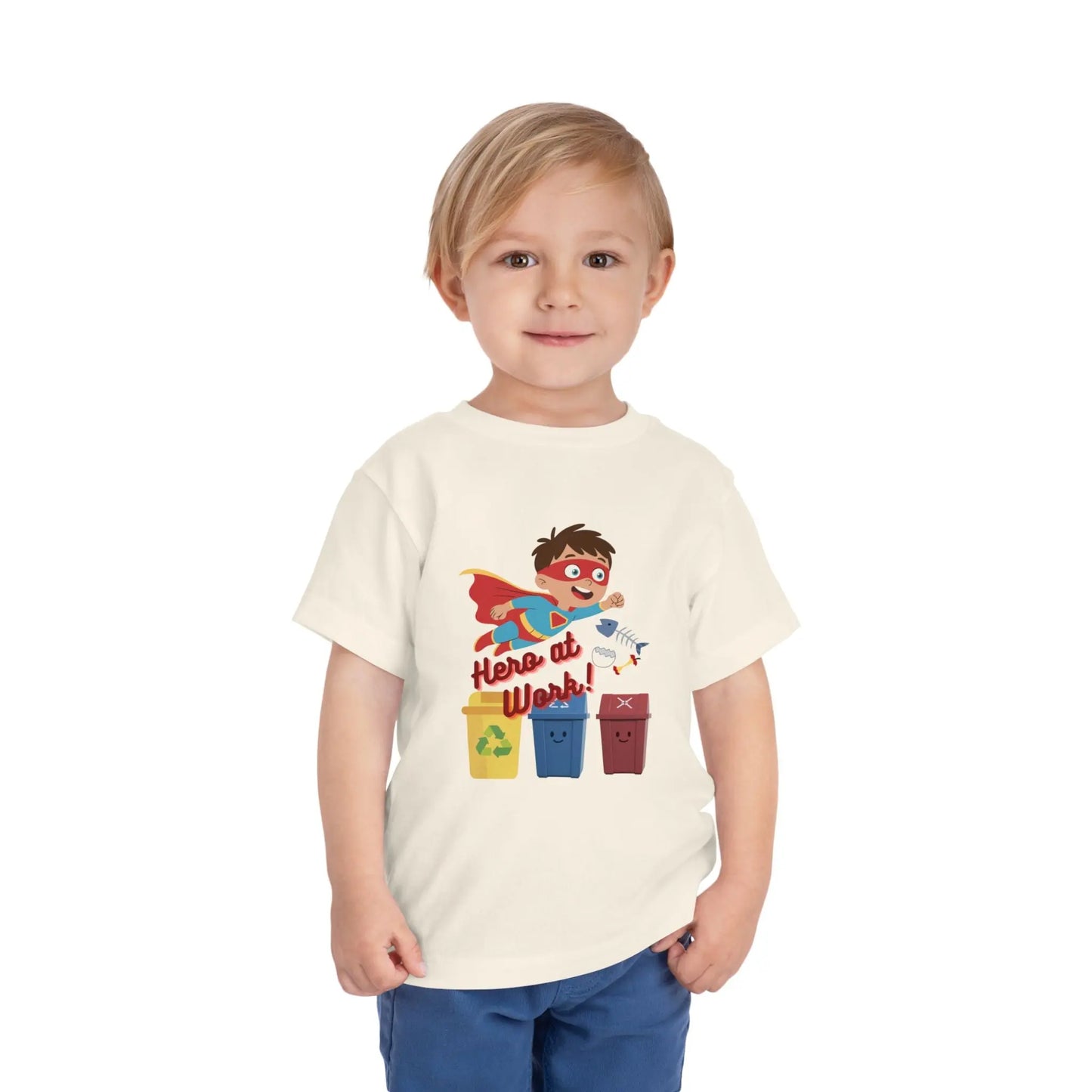 Toddler wearing these inspiring little eco-heroes with this playful toddler recycling shirt. Soft, durable cotton tee featuring a caped superhero sorting bin. Perfect for Earth Day, preschool, and everyday adventures. Natural