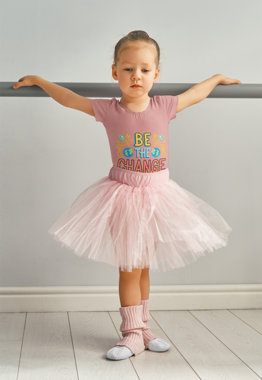 Toddler wearing Be the Change tee with globe icons and hand-drawn lettering, Heather Mauve
