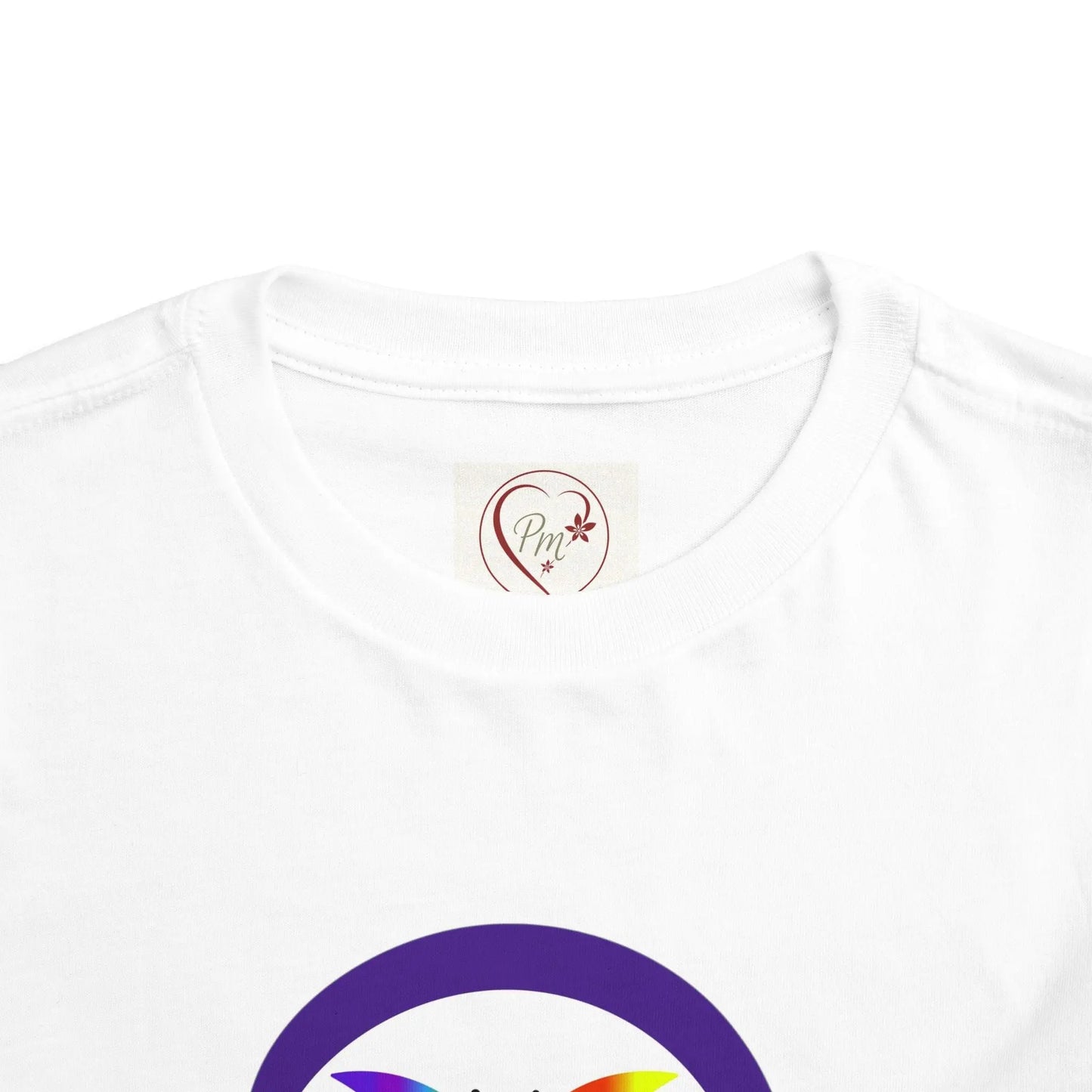 White t-shirt with a PM Creations 25 logo on the neckline and a rainbow symbol on the sleeve against a white background