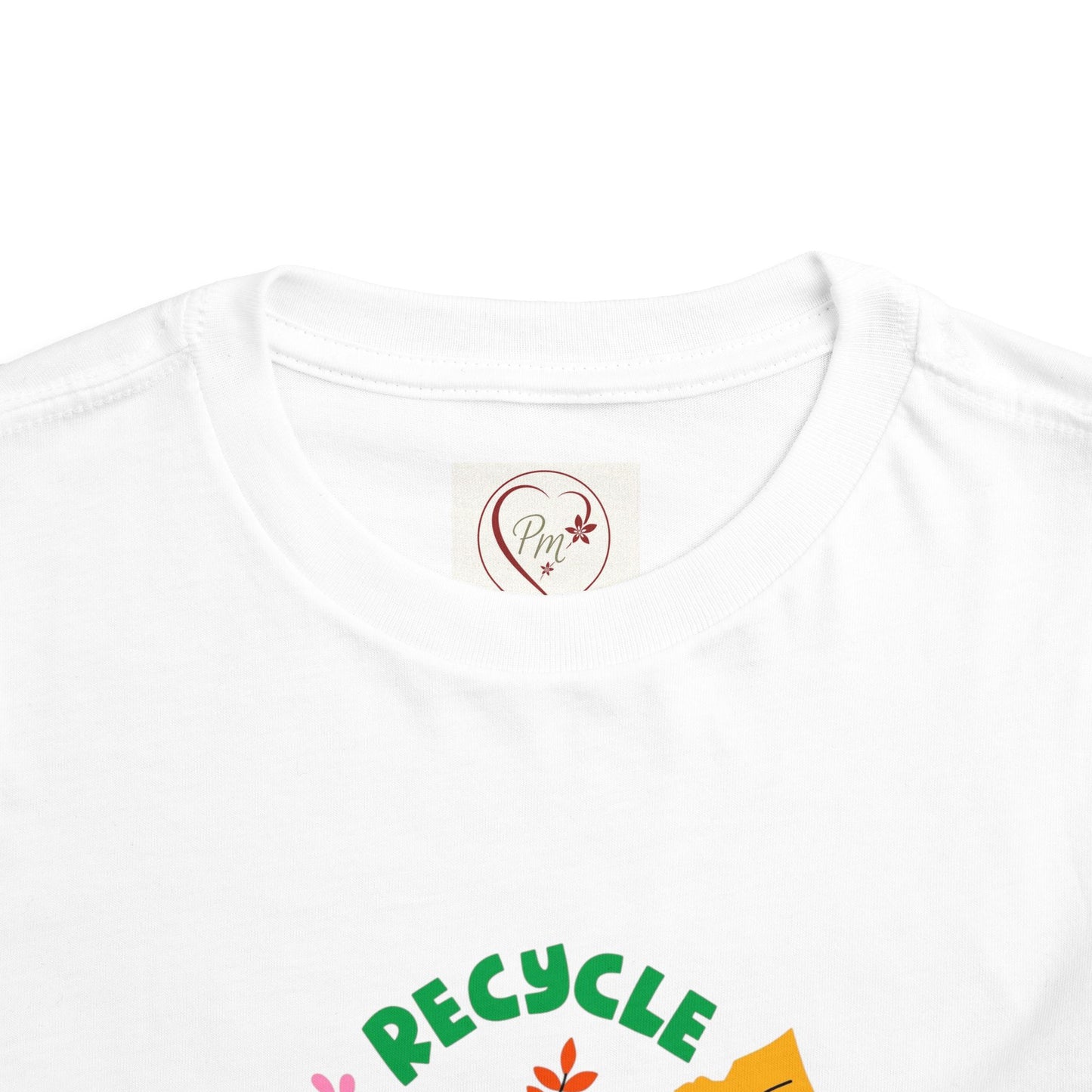 White t-shirt with 'RECYCLE' text and green design on a white background featuring a PM Creations 25 label