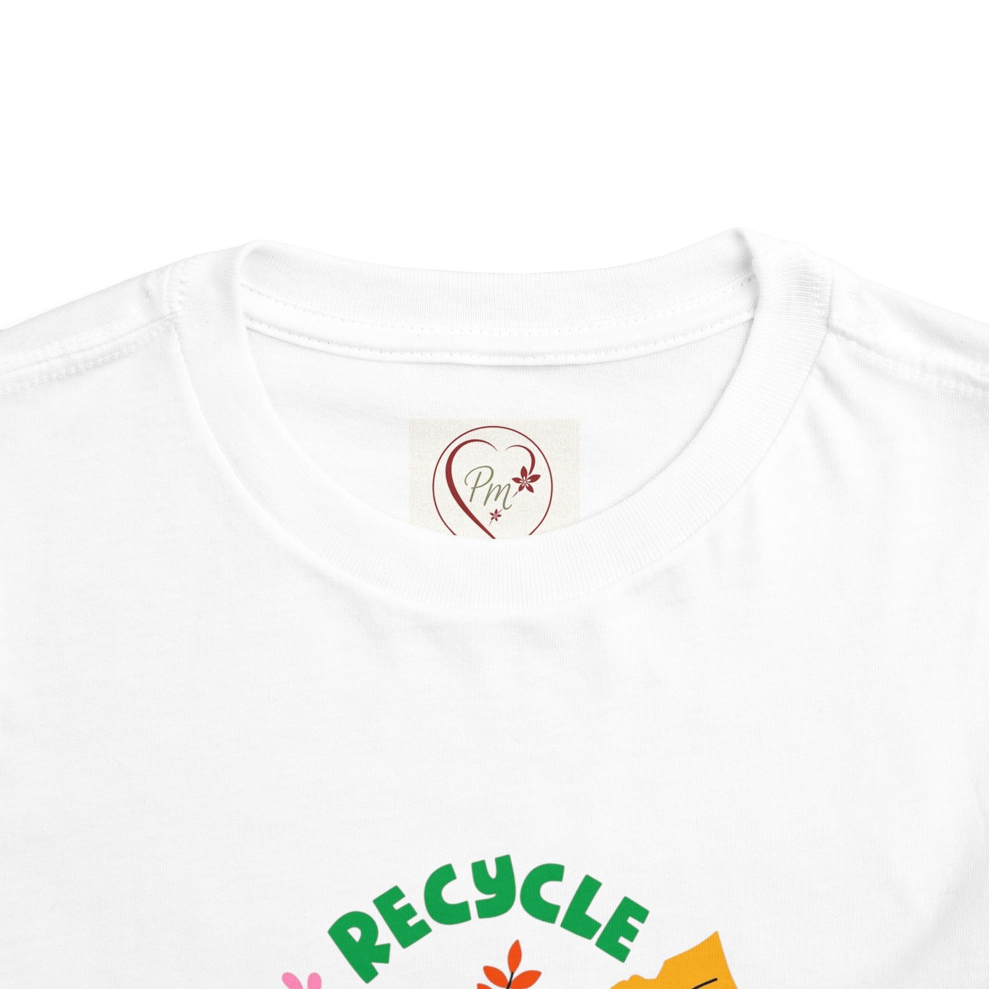 White t-shirt with 'RECYCLE' text and green design on a white background featuring a PM Creations 25 label