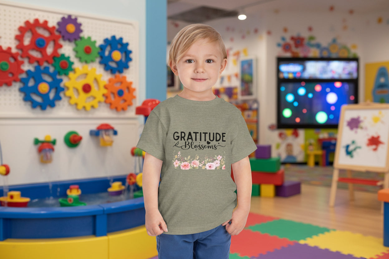 Toddler wearing Gratitude Blooms tee with watercolor floral design, Heather Stone
