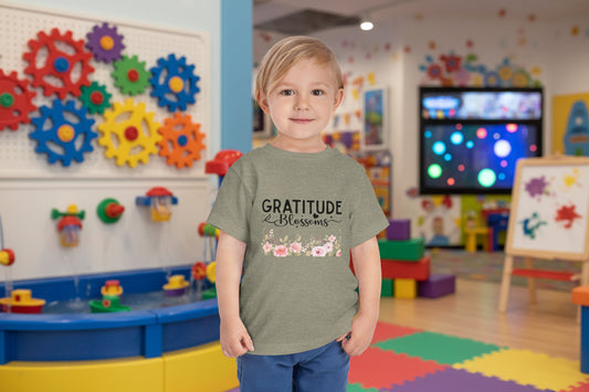 Toddler wearing Gratitude Blooms tee with watercolor floral design, Heather Stone
