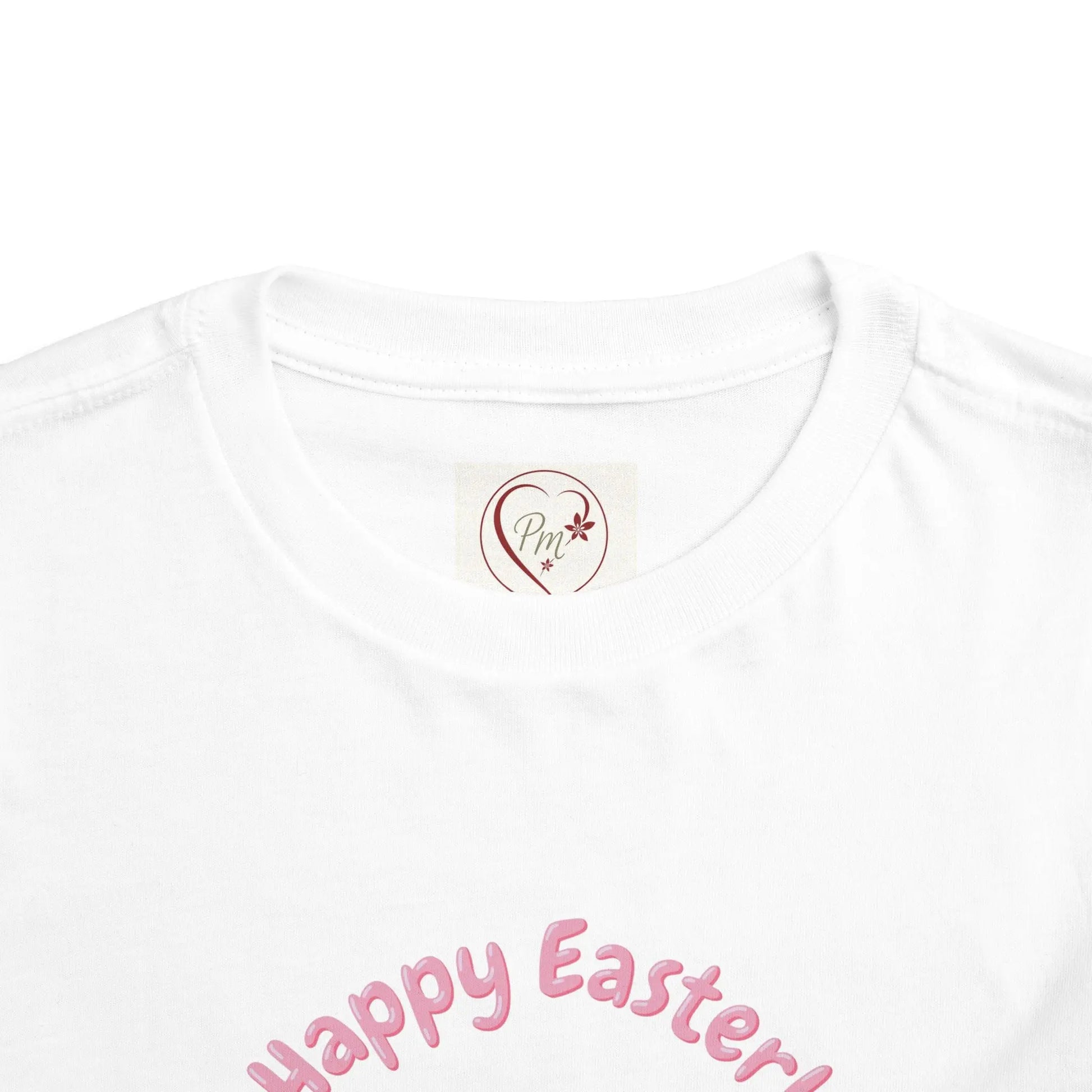 White t-shirt with 'Happy Easter!' text and a PM Creations 25 logo on a white background